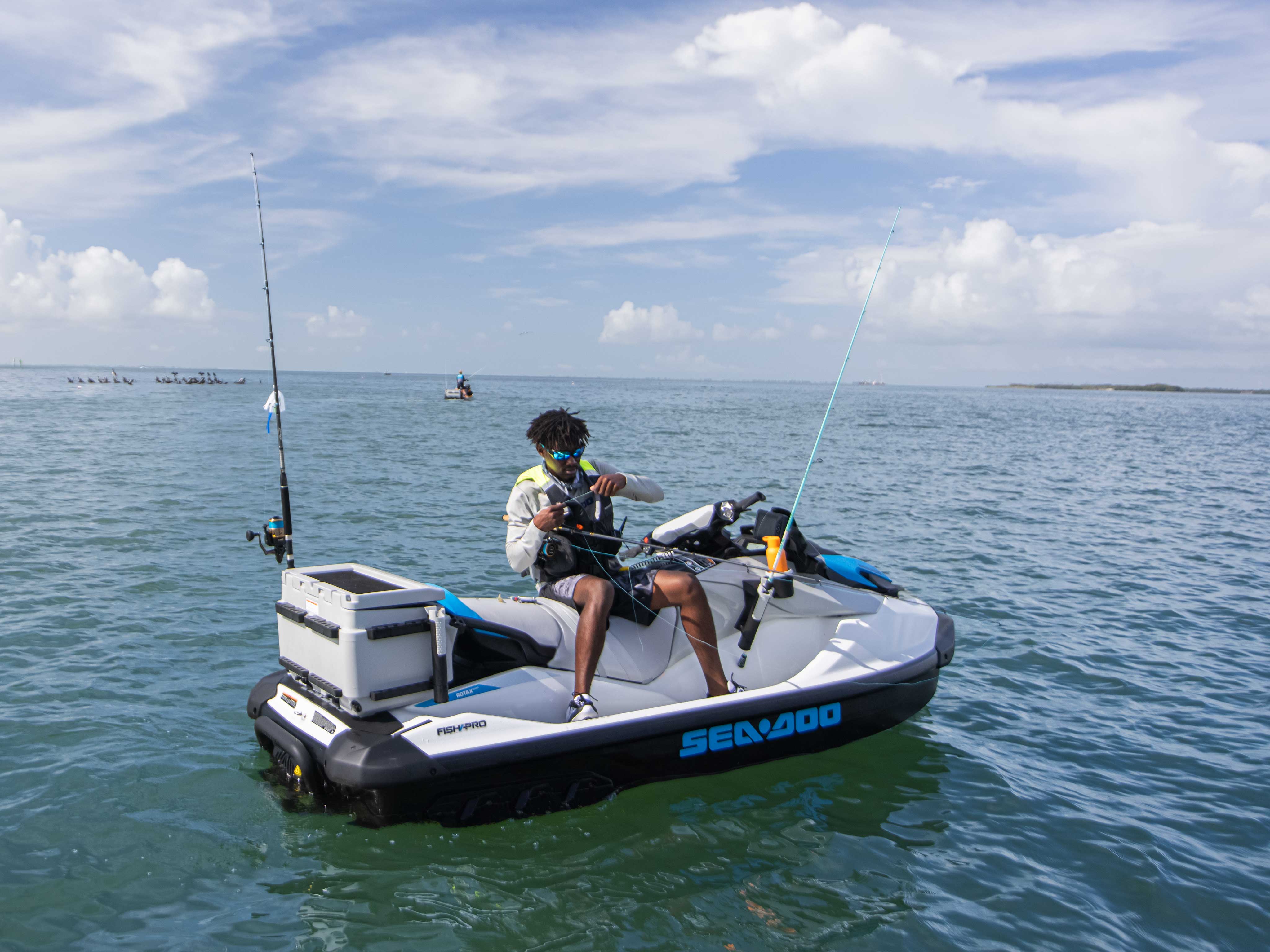 Man riding fishing with a Sea-Doo FishPro Scout