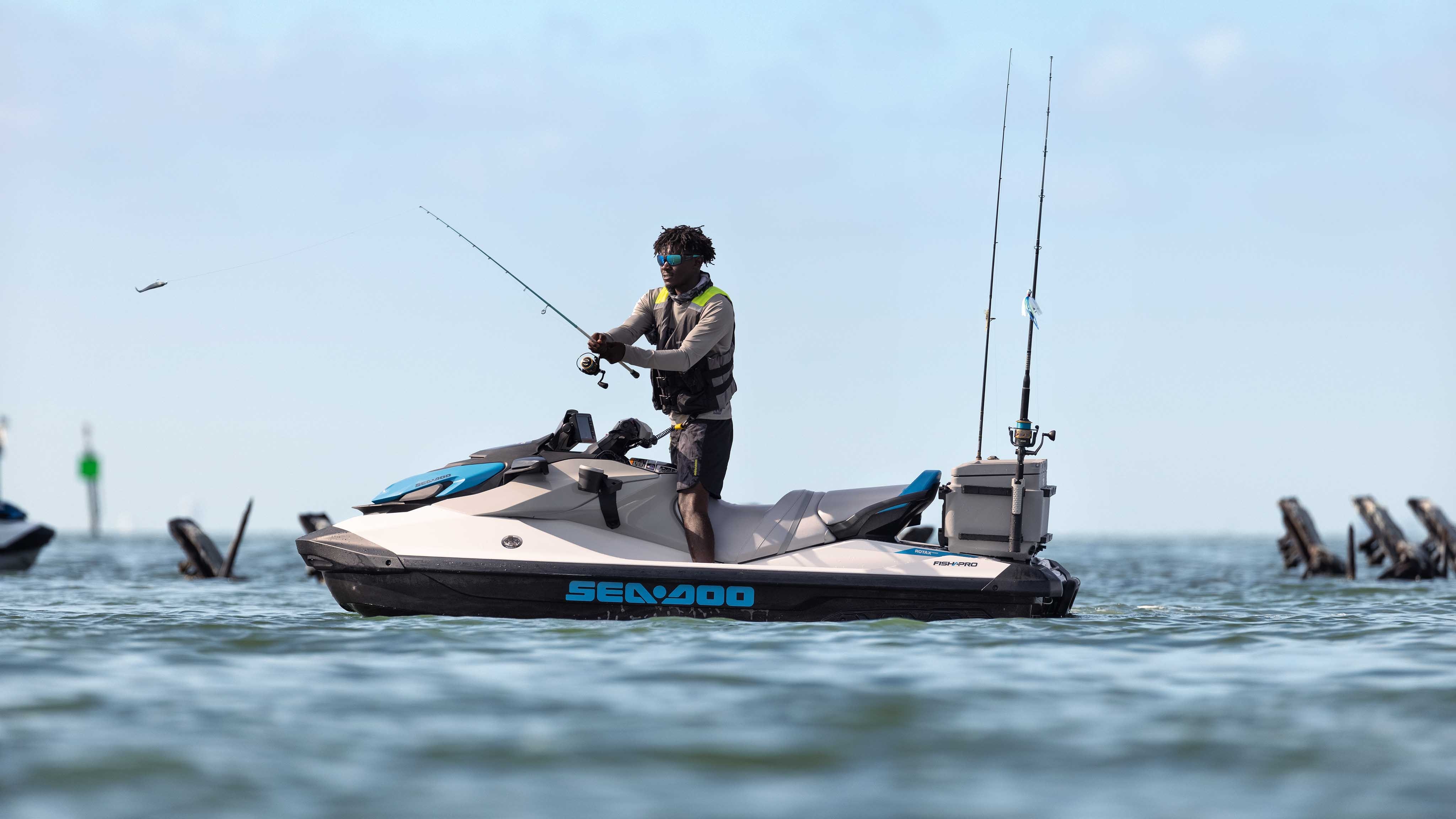 Man standing on his Sea-Doo FishPro