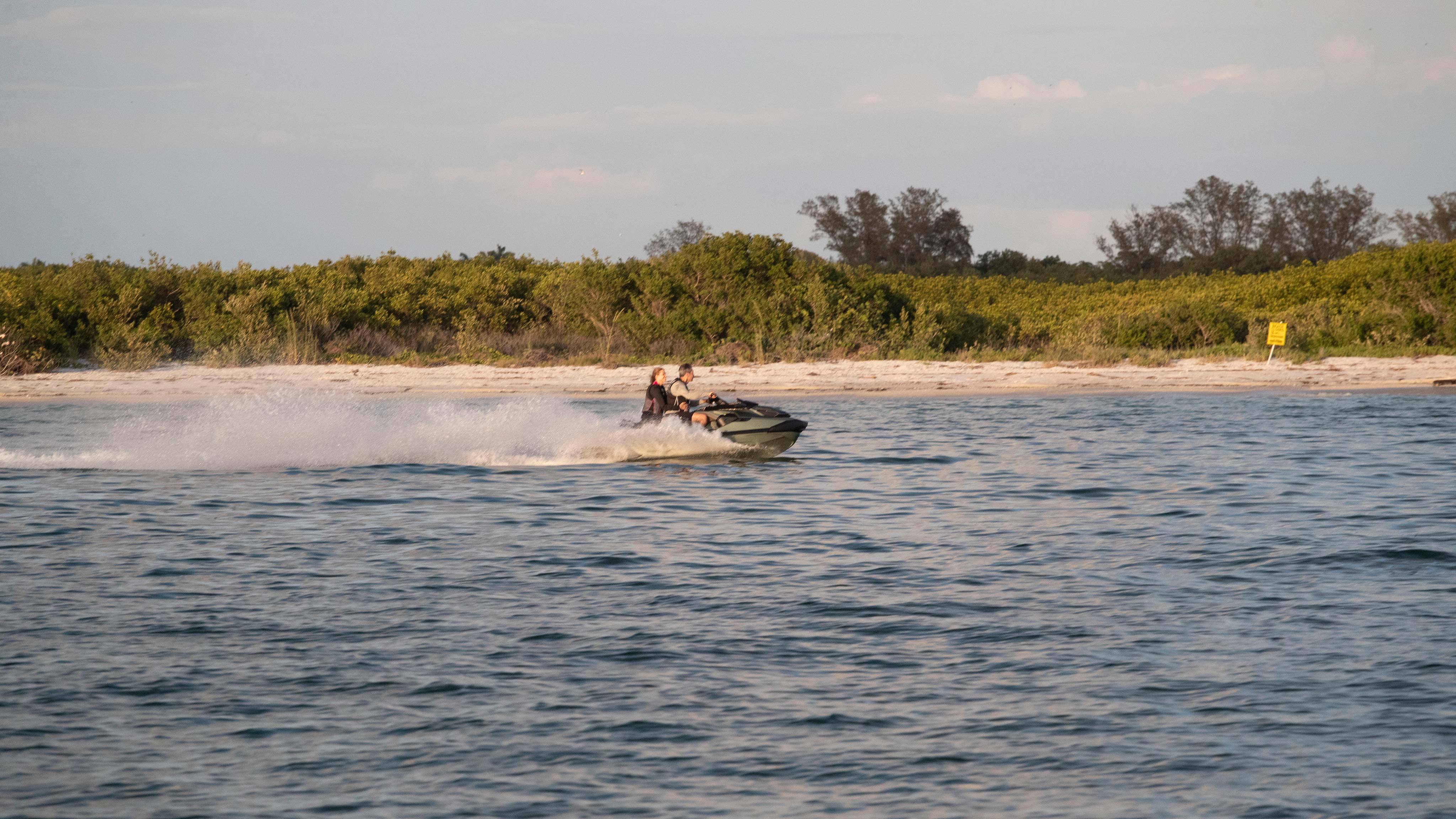 Couple riding on the new 2022 Sea-Doo GTX 