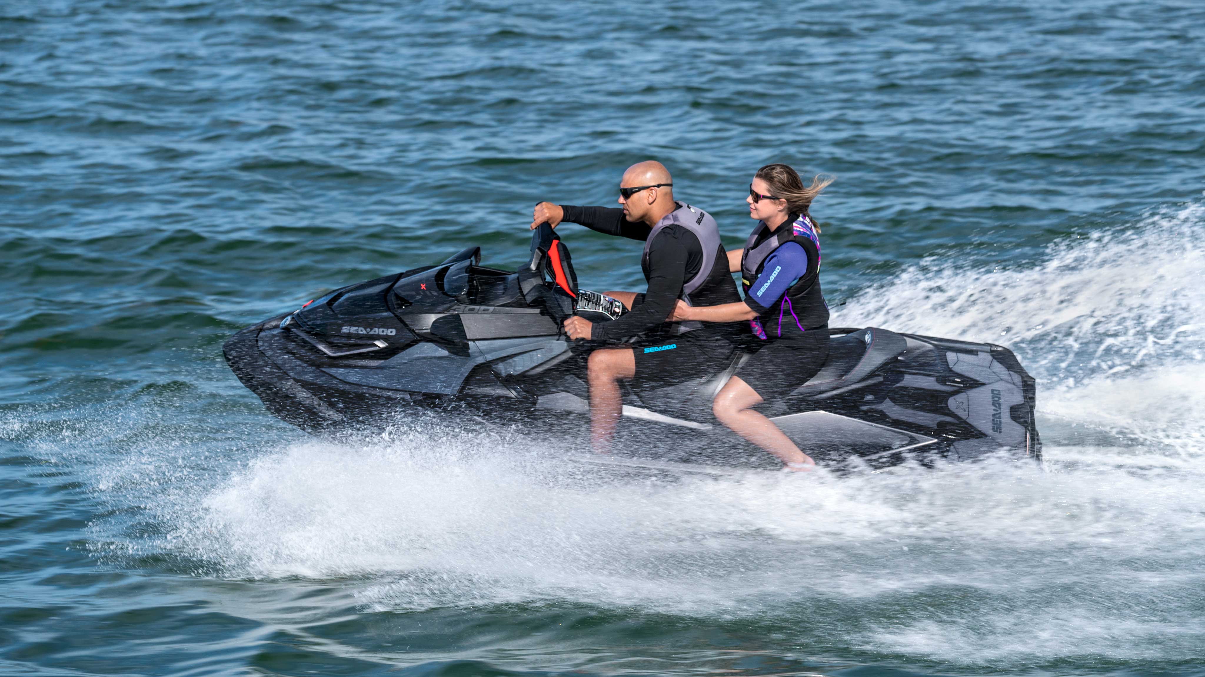 Couple speeding with a Sea-Doo RXT-X