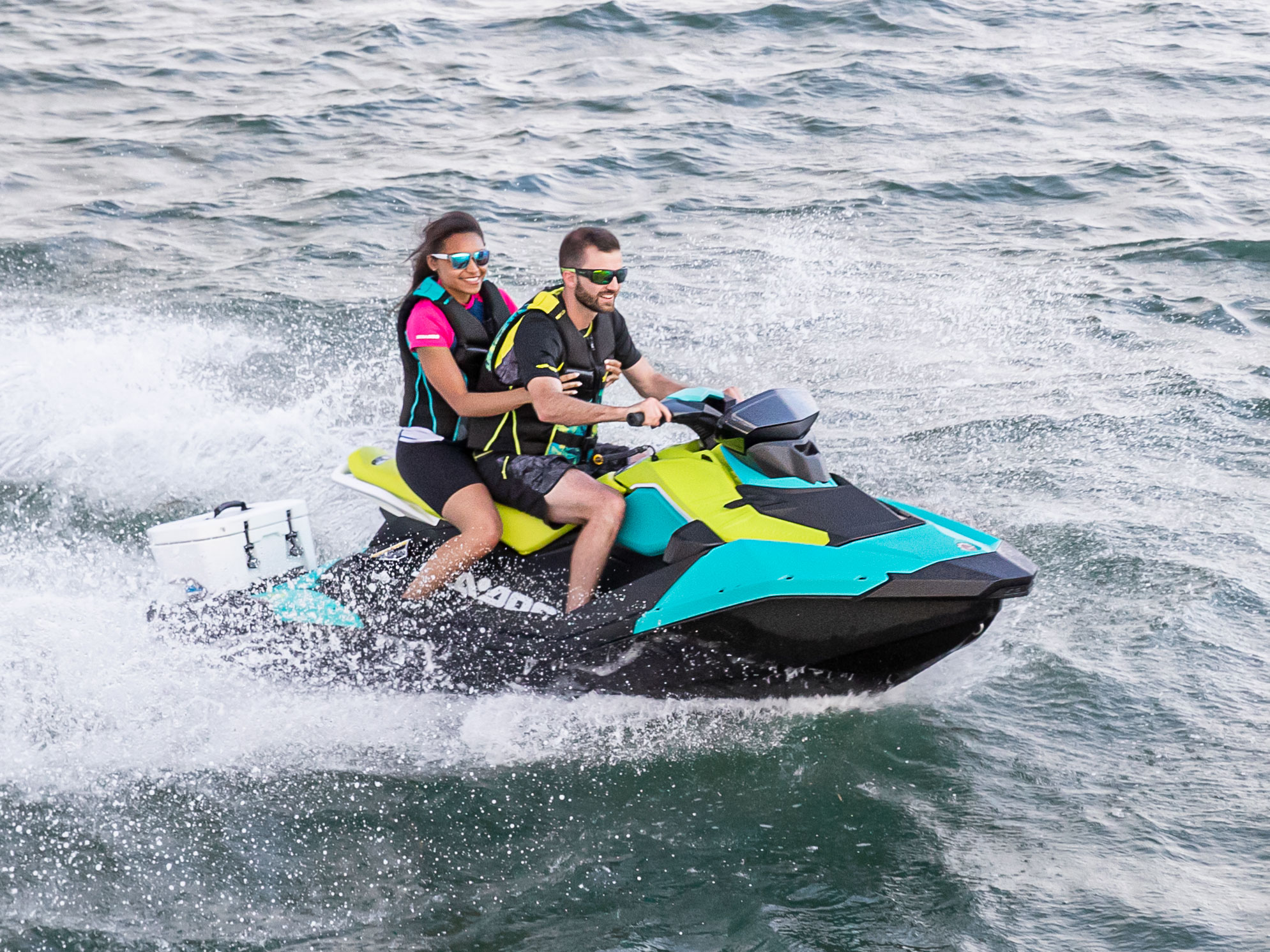 Couple riding their Blue Sea-Doo Spark