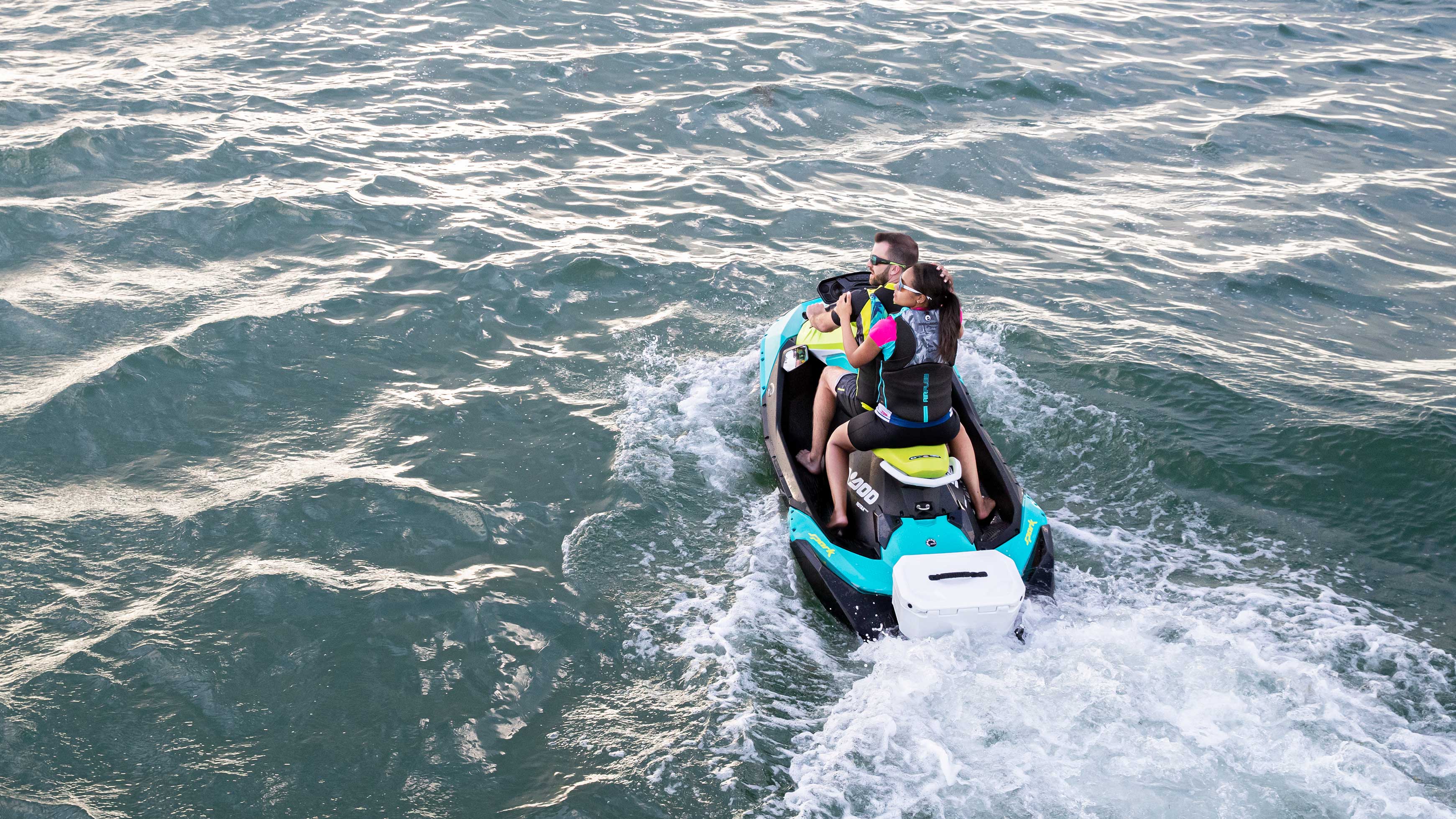 Couple riding a blue Sea-Doo Spark