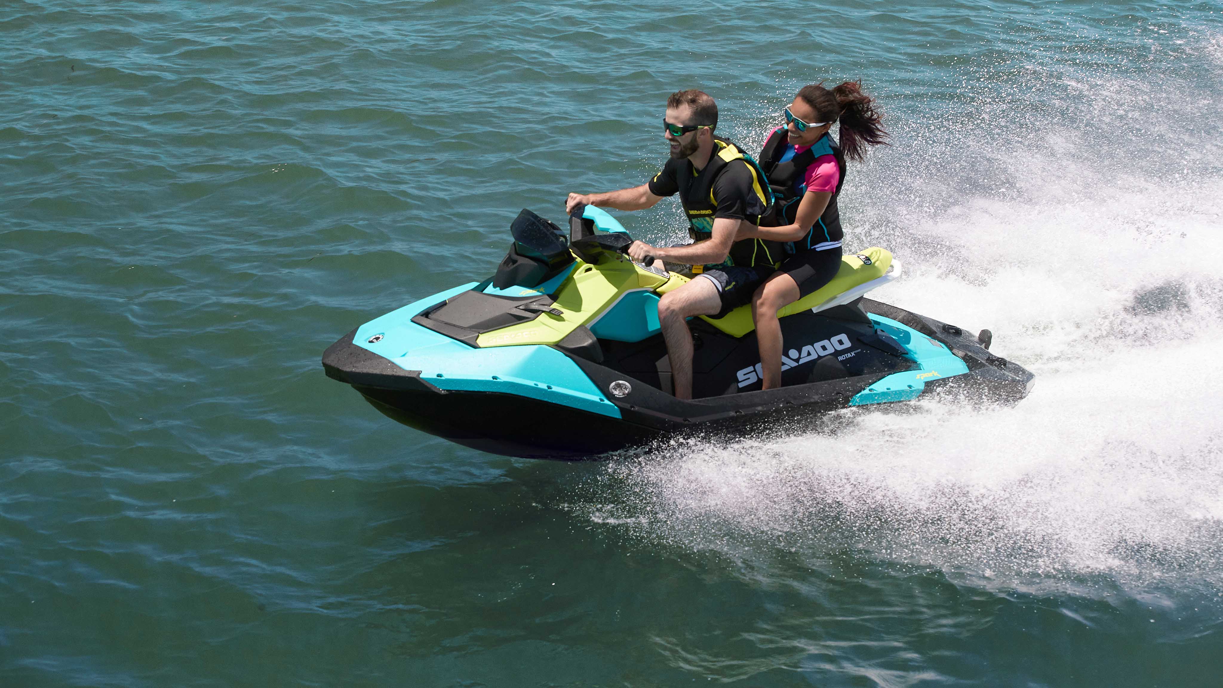 Couple riding their 2022 Sea-Doo Spark