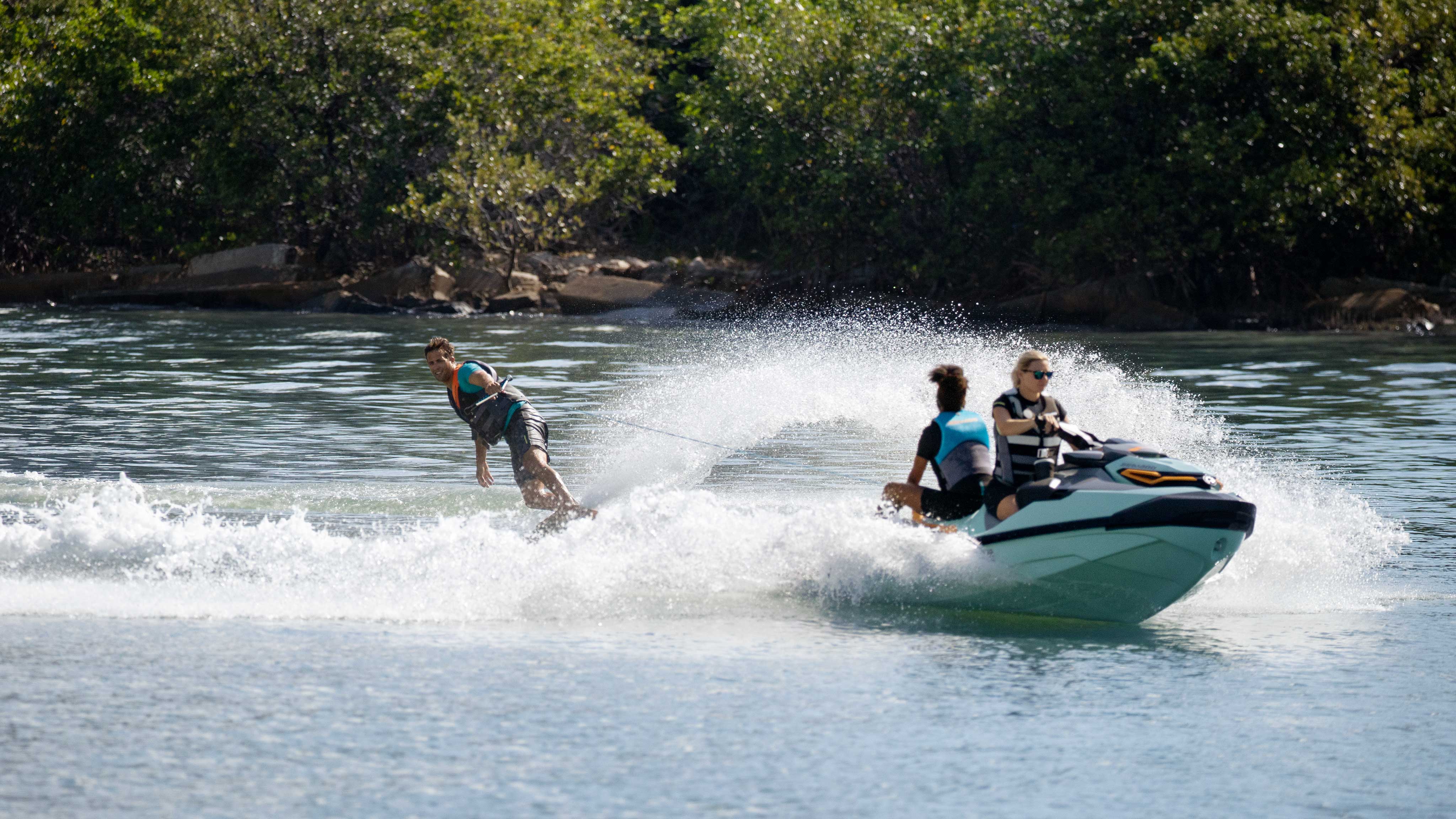 Man wakeboarding behind the new Sea-Doo Wake Pro