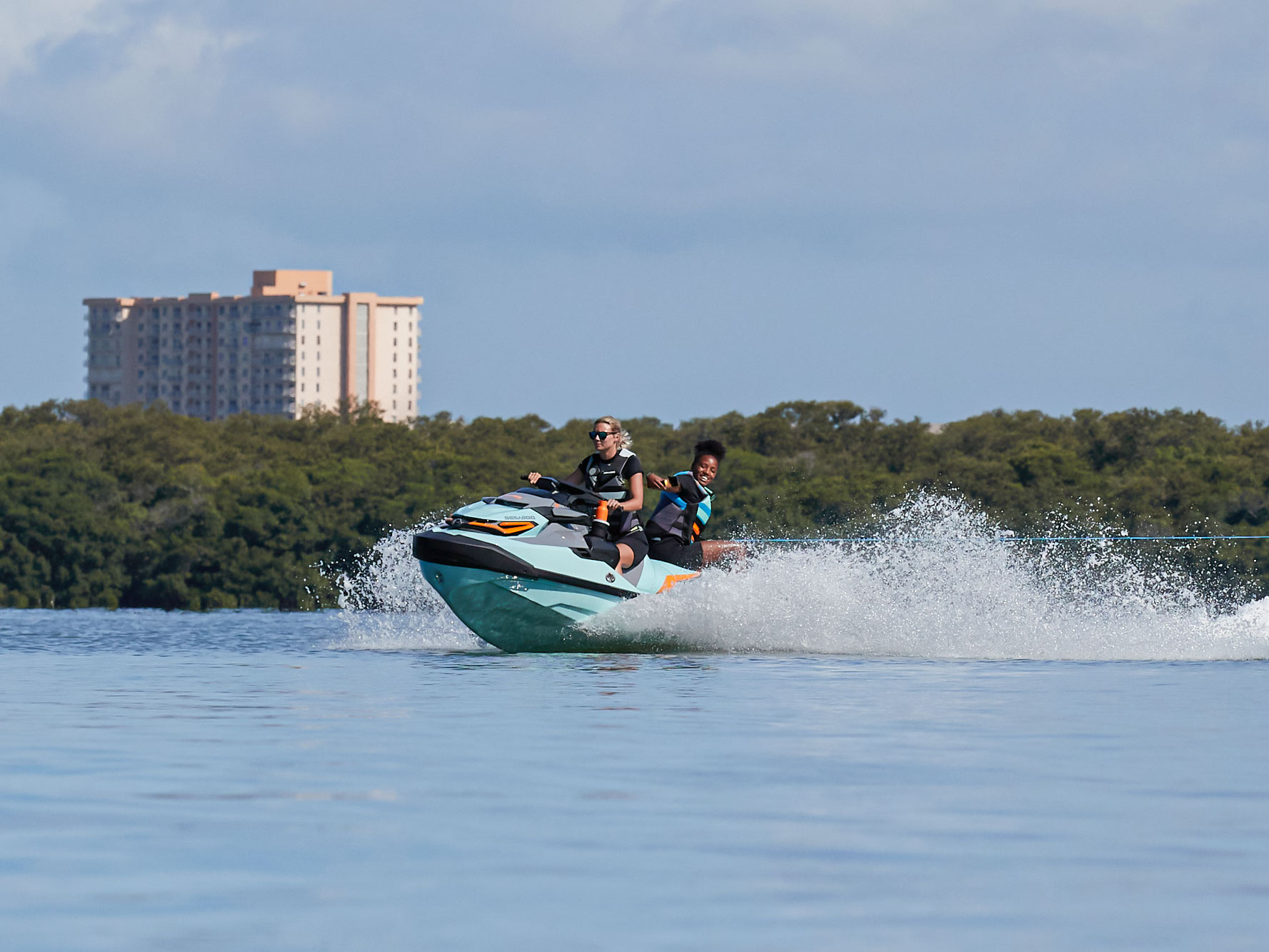 Friends enjoying a ride on a Sea-Doo Wake Pro