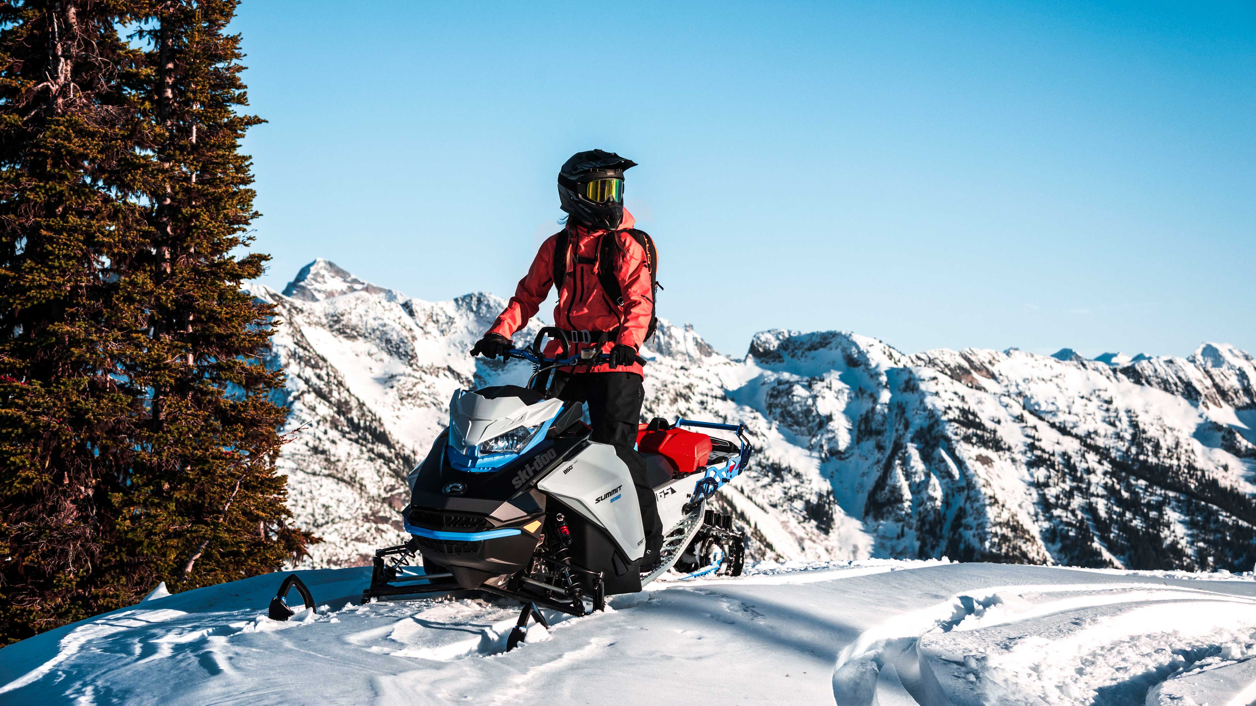 Man riding a Ski-Doo snowmobile