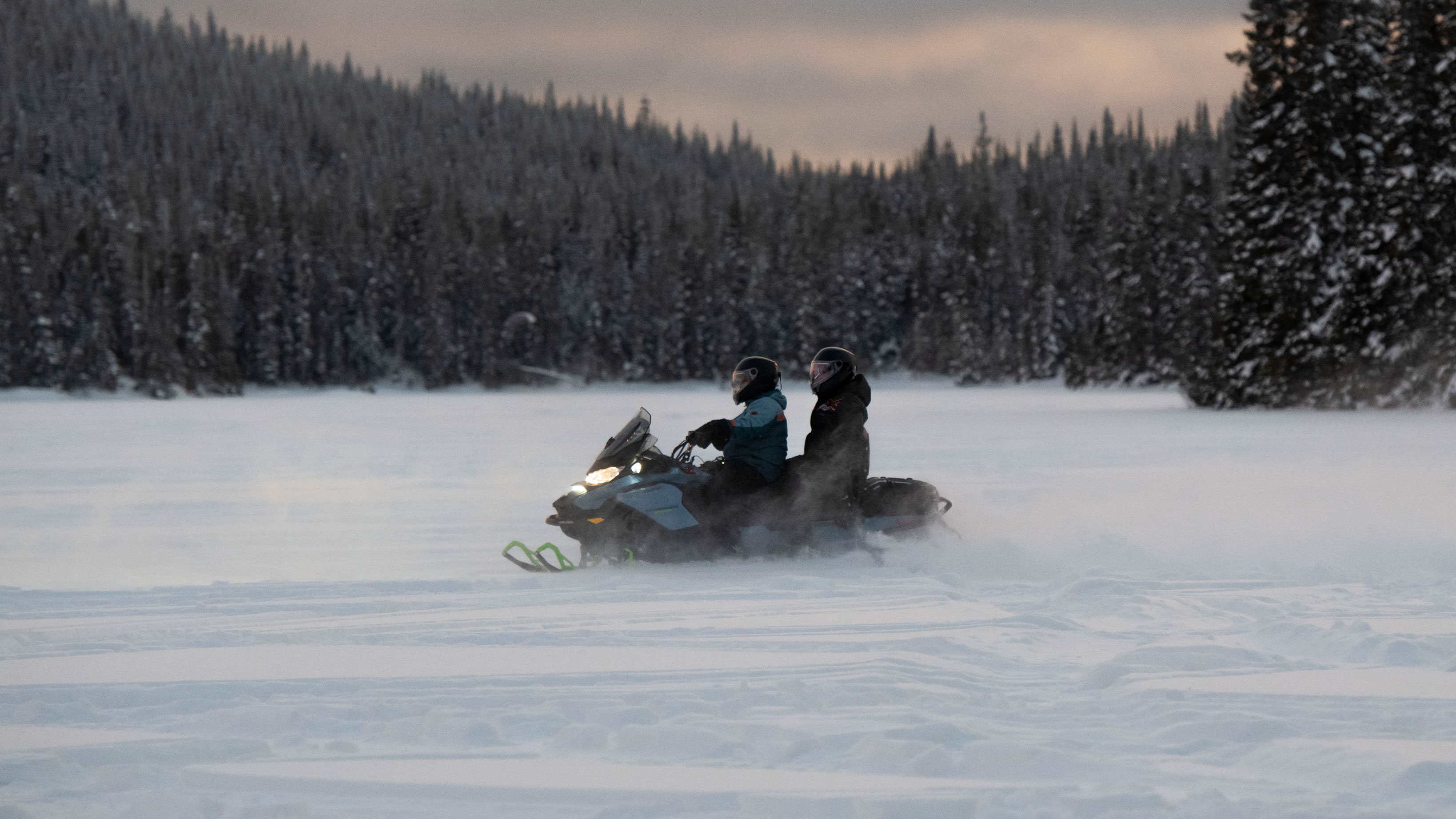 Couple riding their 2022 Ski-Doo Renegade