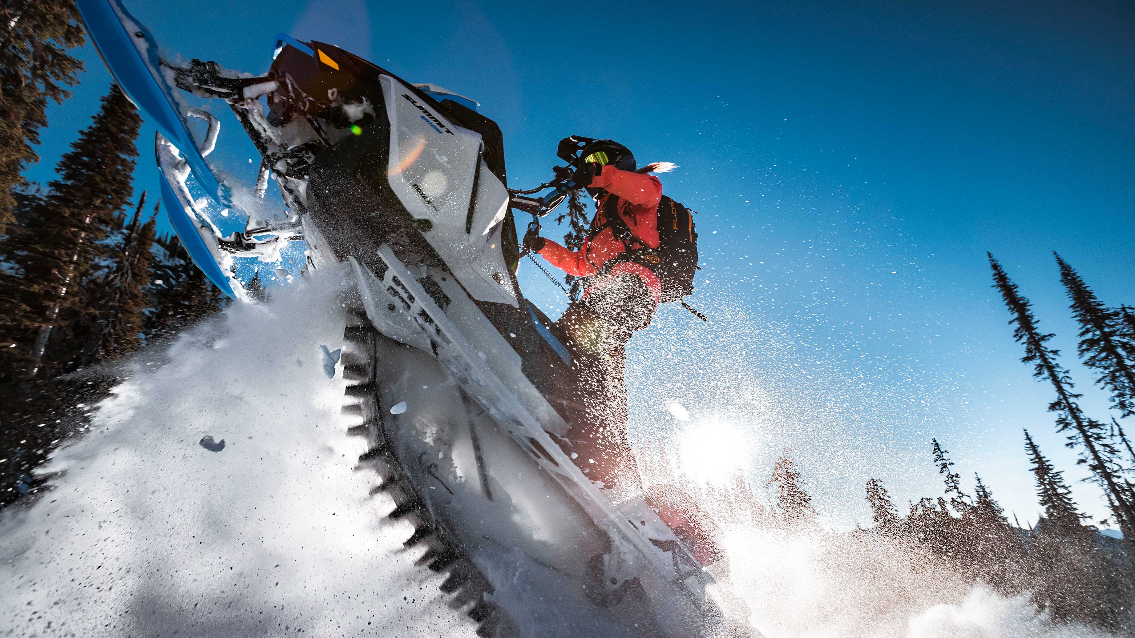 Man riding a 2022 Ski-Doo Summit in Deep-Powder