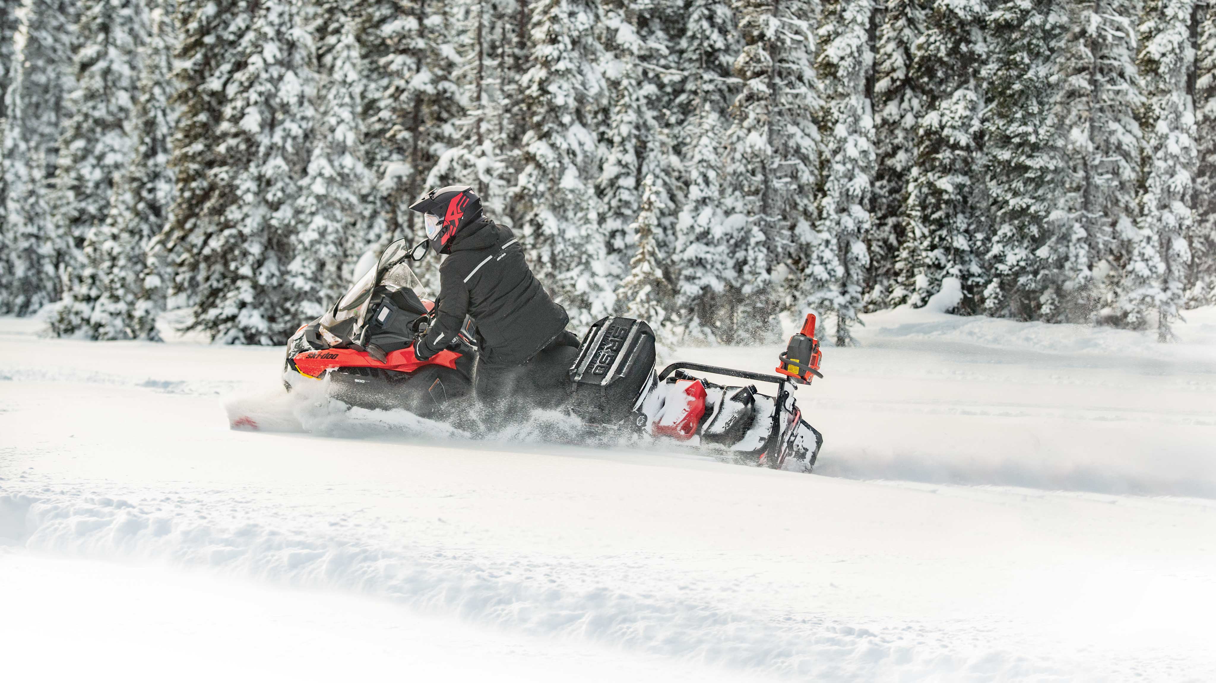 Man riding a Ski-Doo Skandic fully equipped