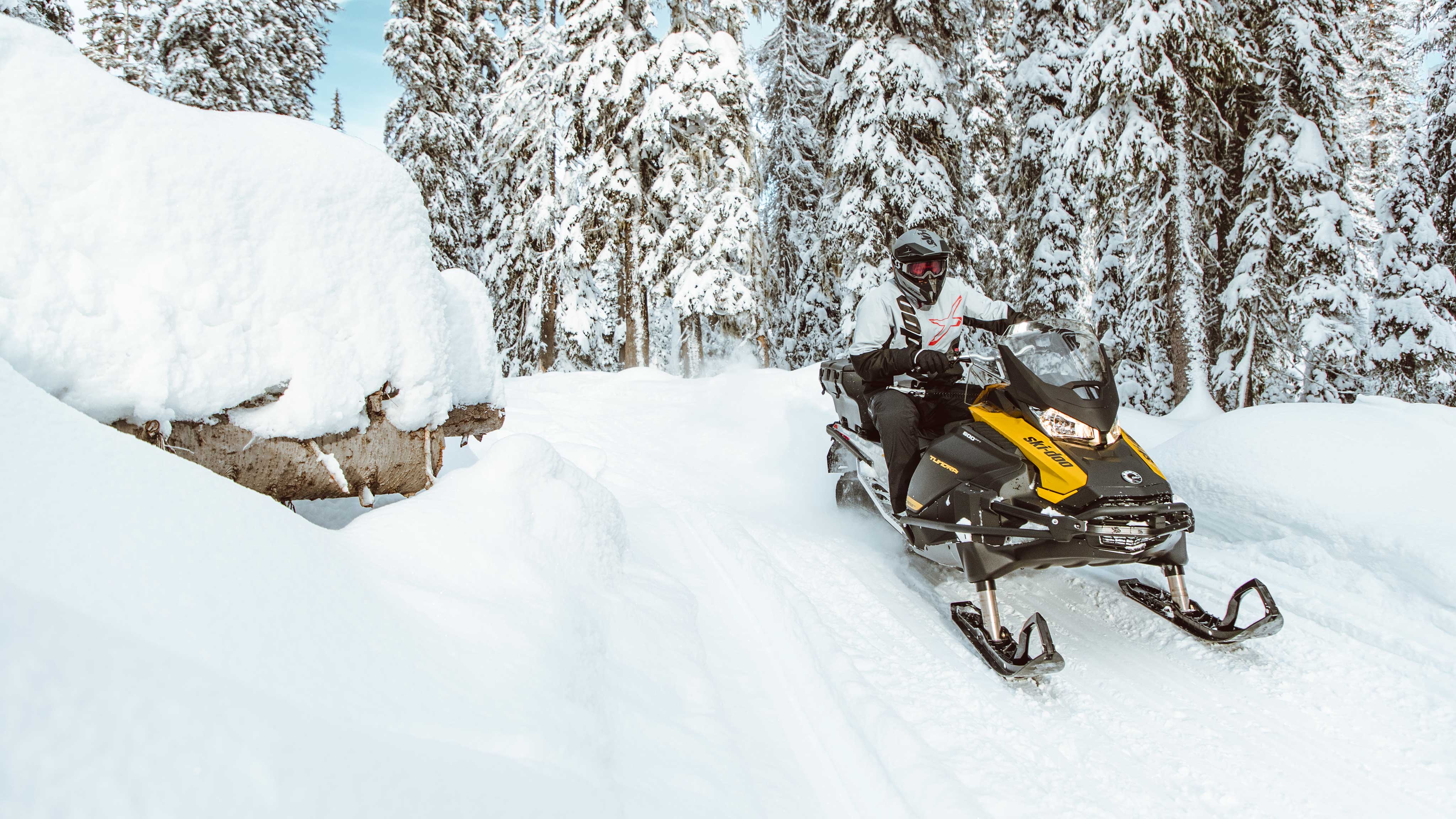 Man riding a Ski-Doo Tundra with a cargo box