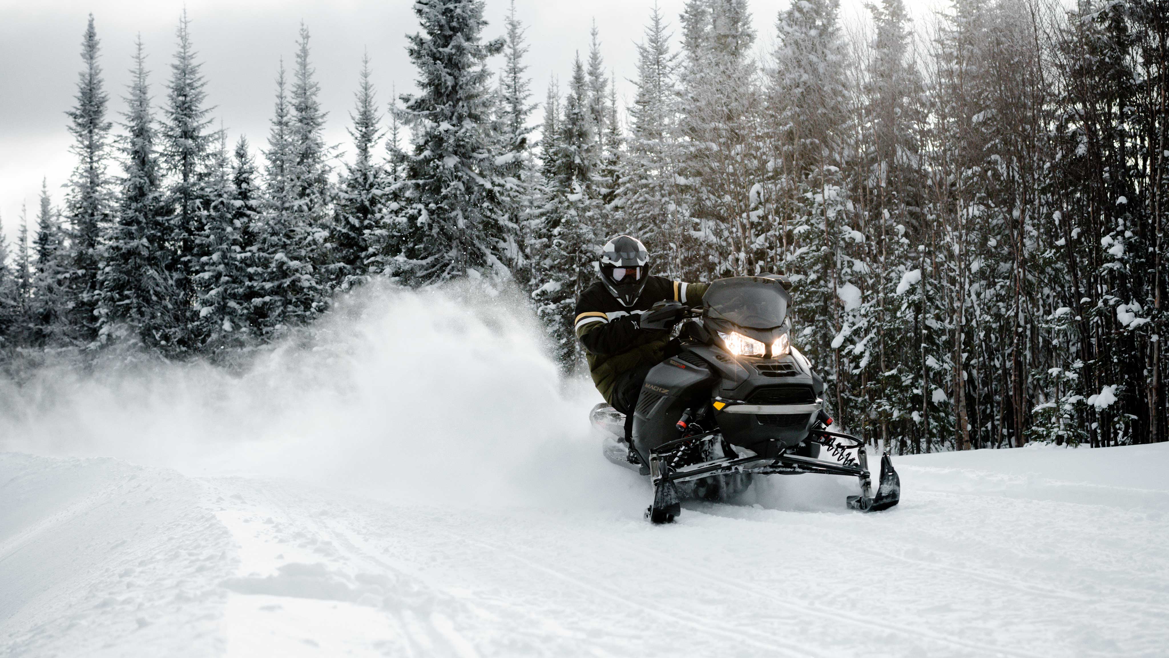 Pilot carving with his 2022 Ski-Doo Mach-Z