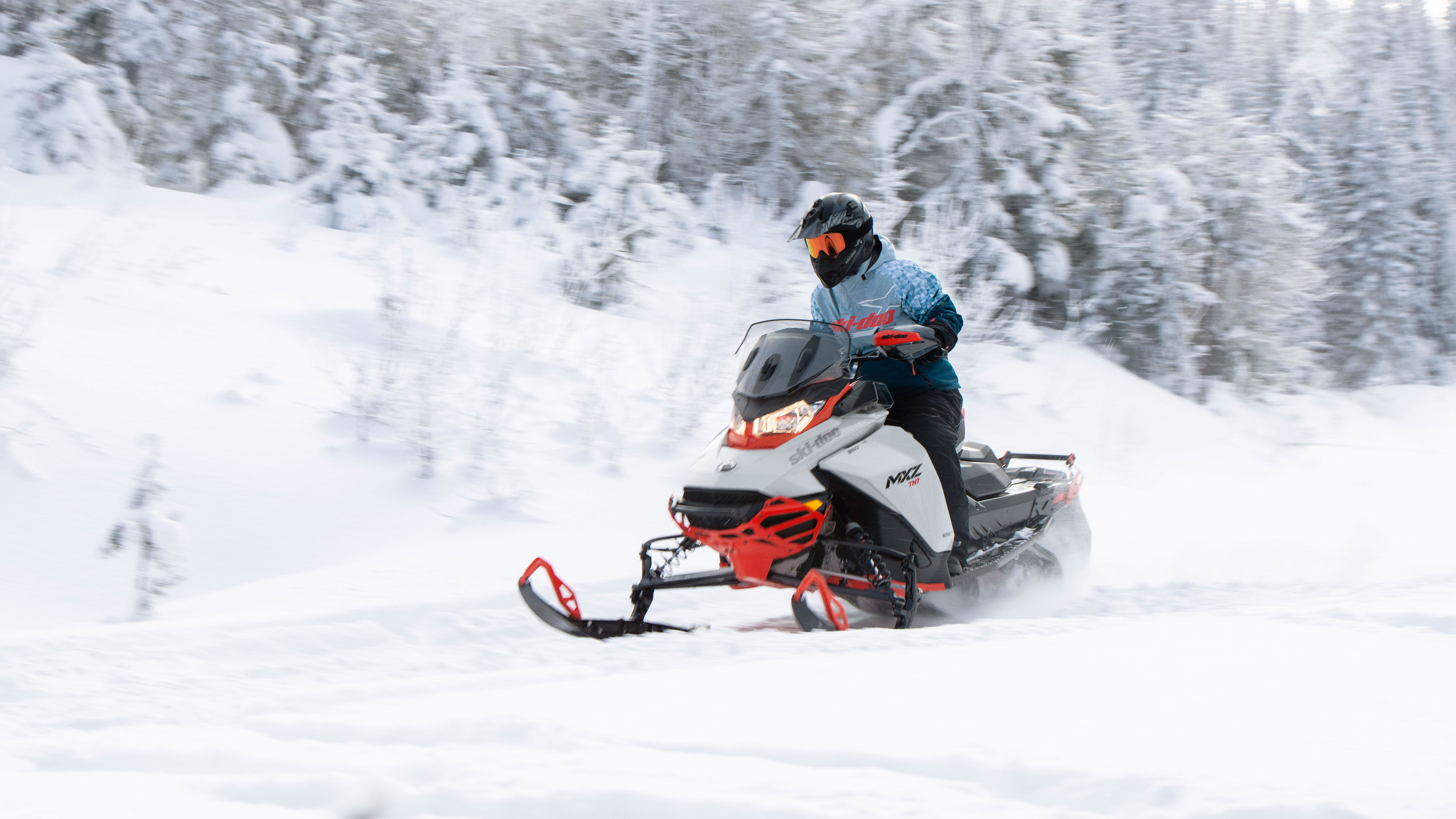 Man riding the new Ski-Doo MXZ on a trail