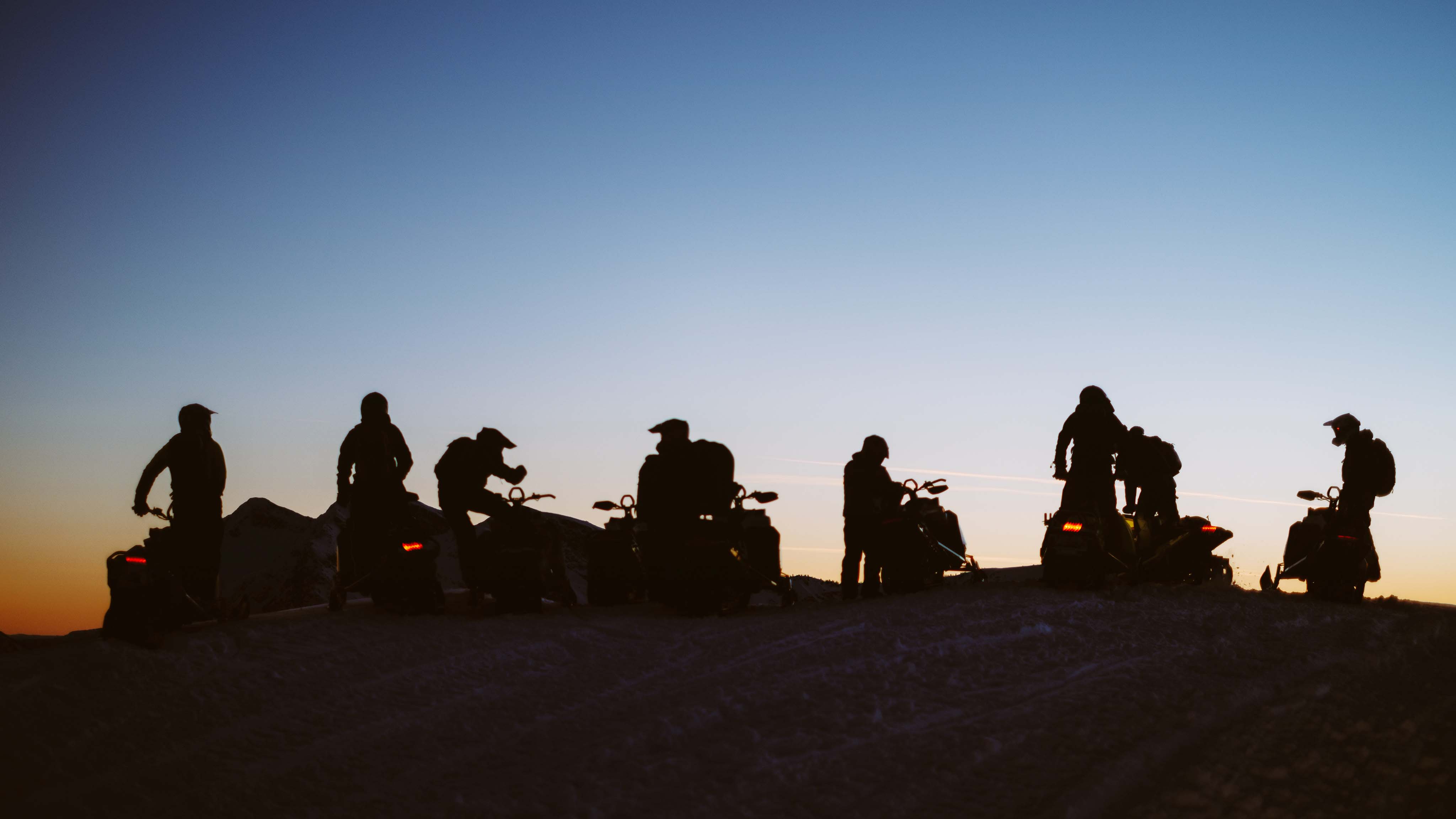 7 Ski-Doo riders stopped on a dawn ride