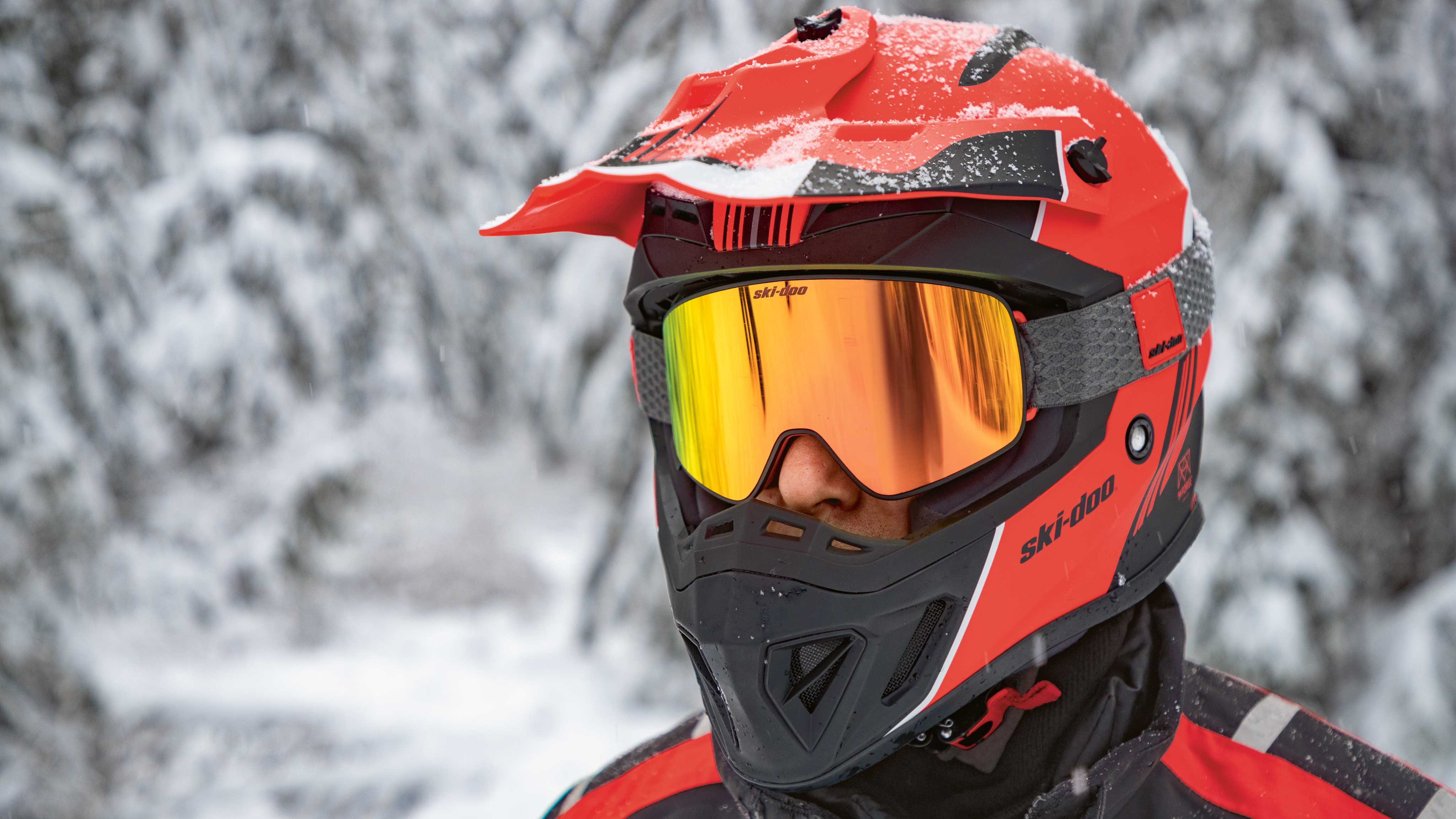 Man wearing Snowmobile helmet and goggles