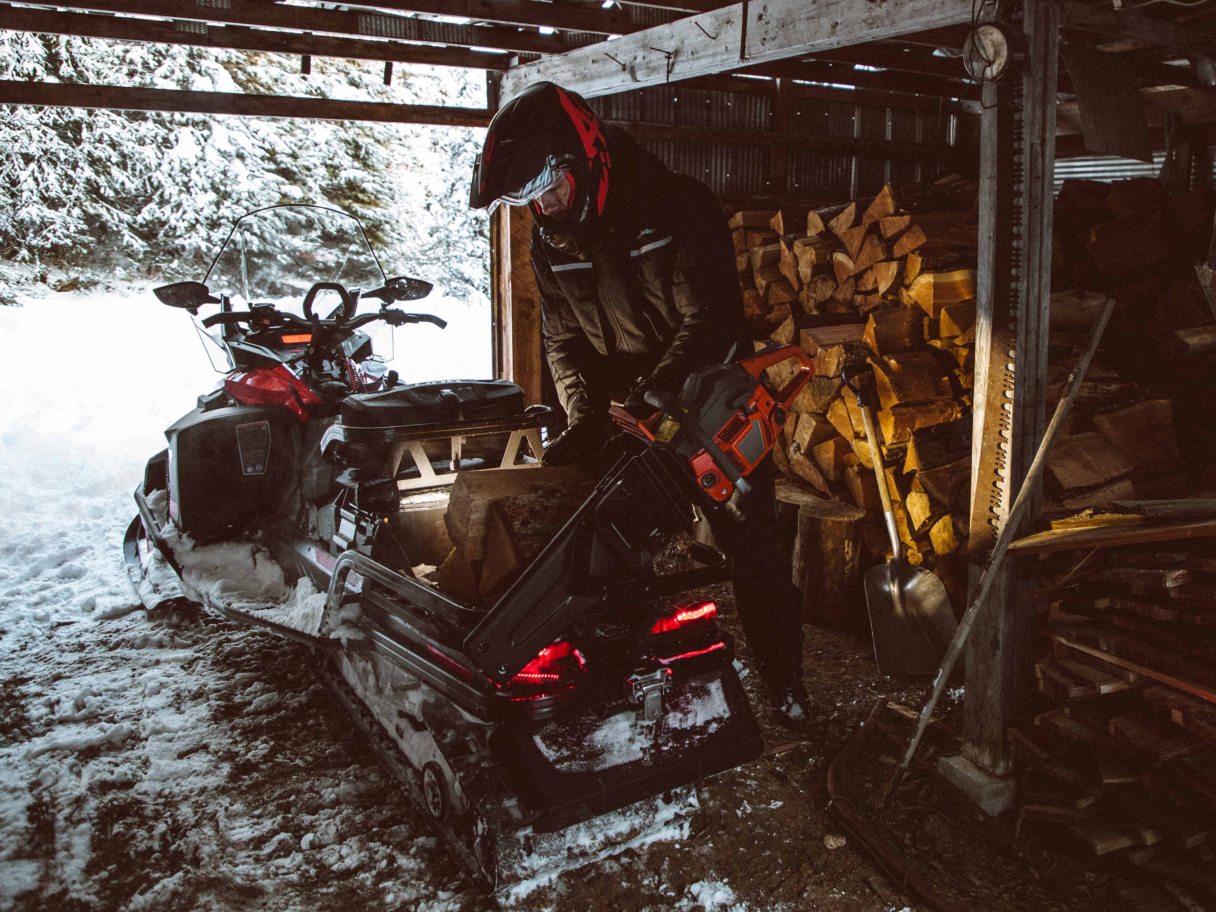 Man working with a Ski-Doo Skandic