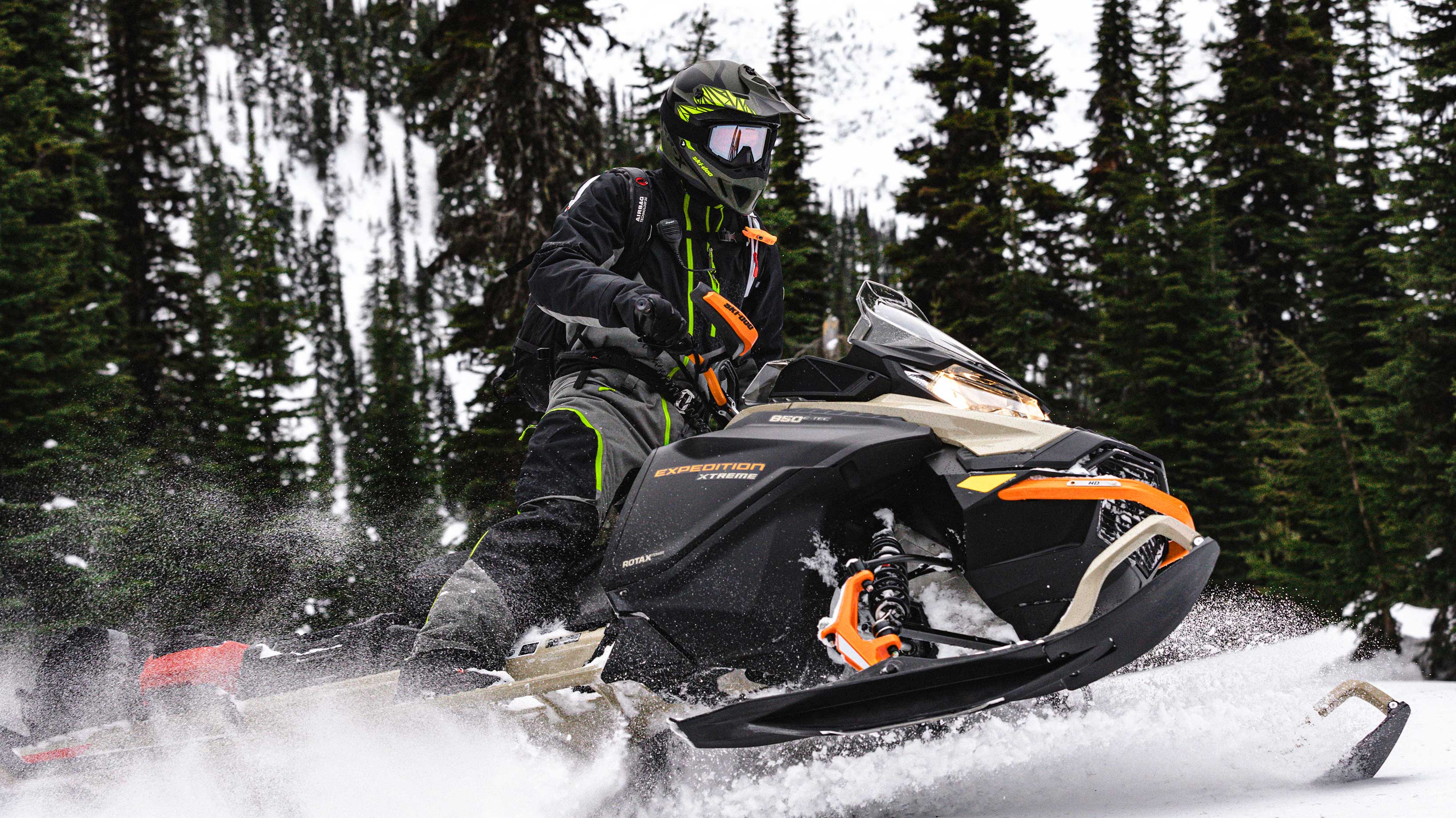 Men riding a Ski-Doo Expedition