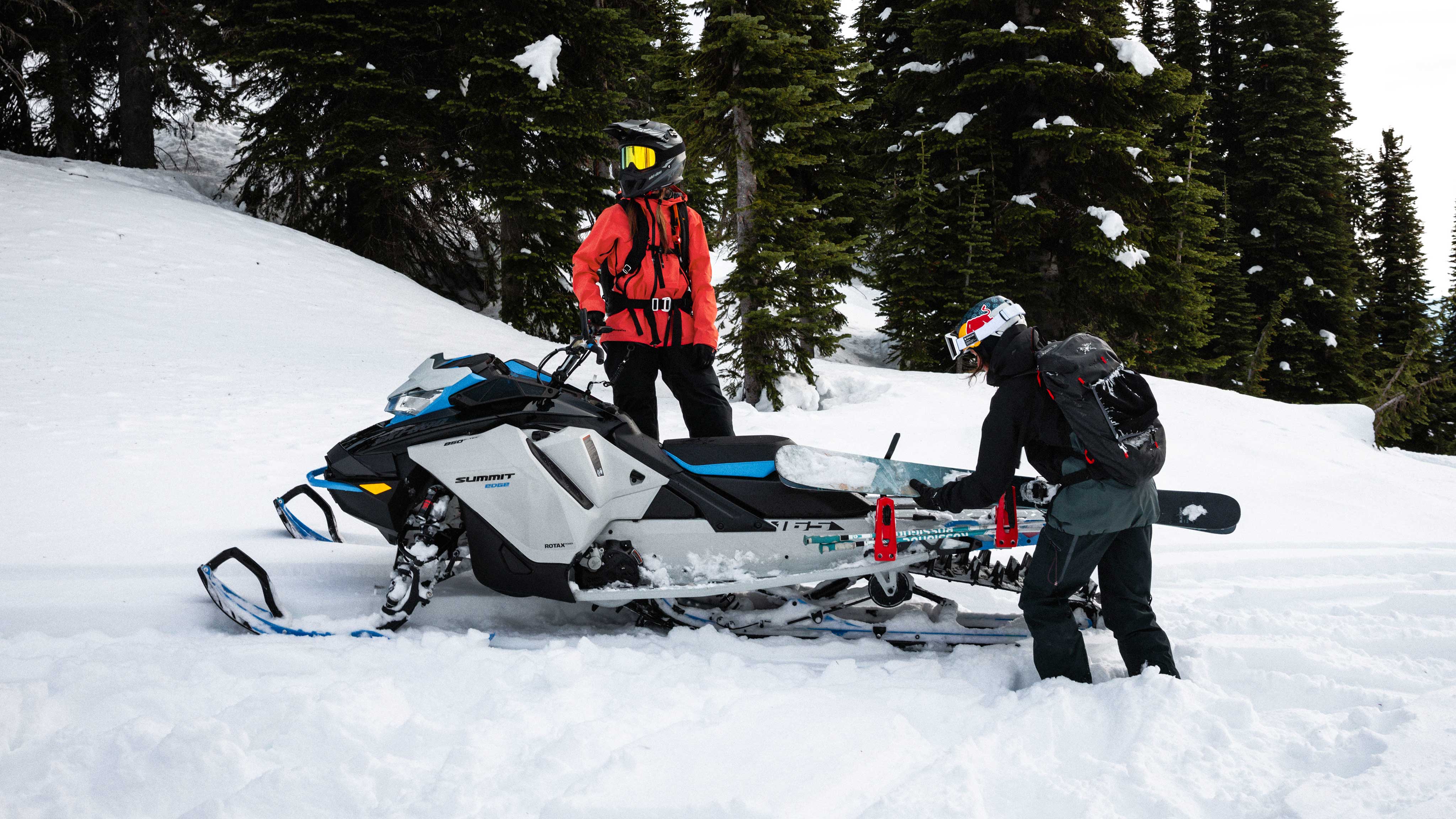 2 riders prepraring a Sled skiing session with a Ski-Doo Summit