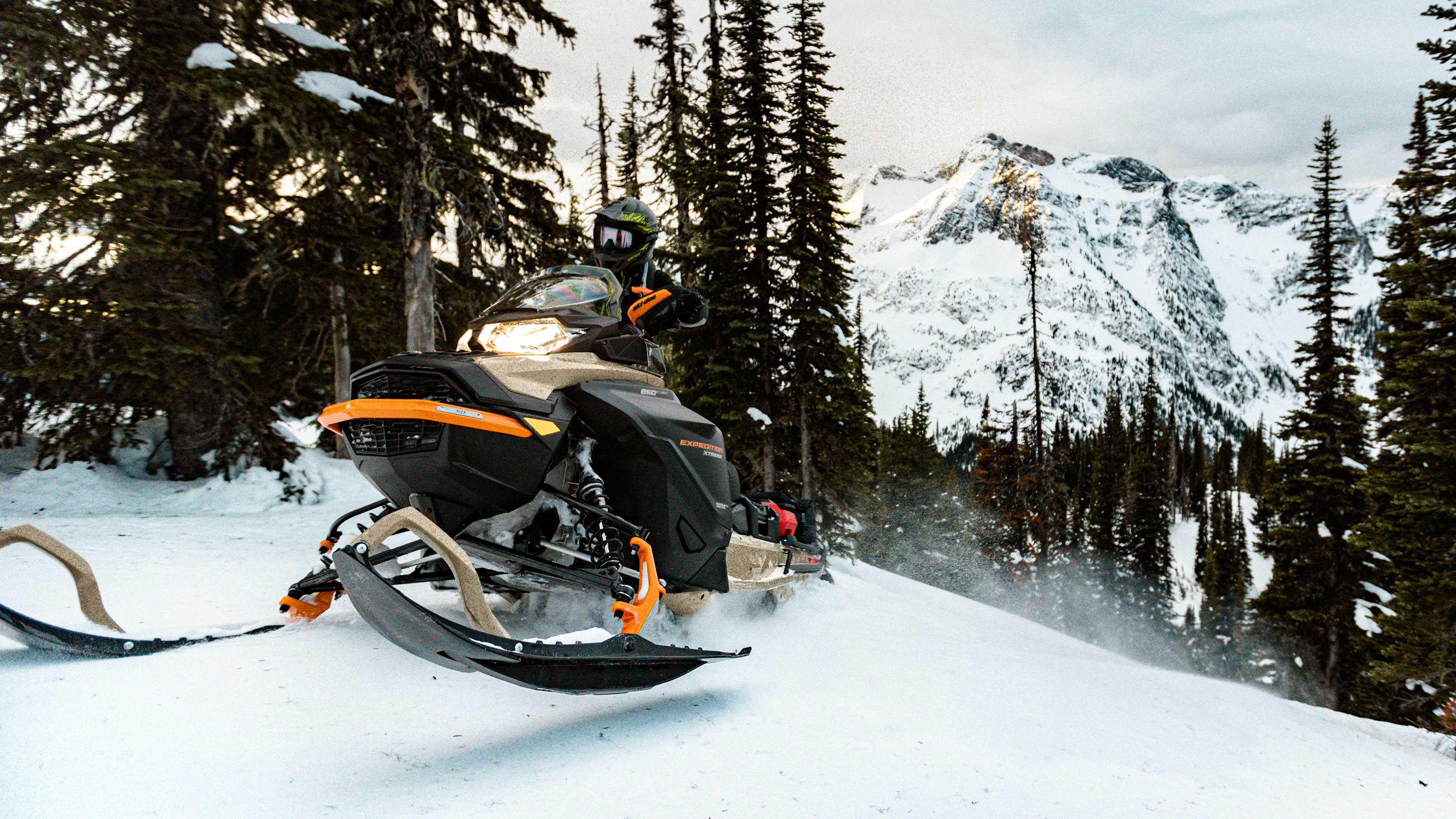 Man driving the 2022 Ski-Doo Expedition on a trail