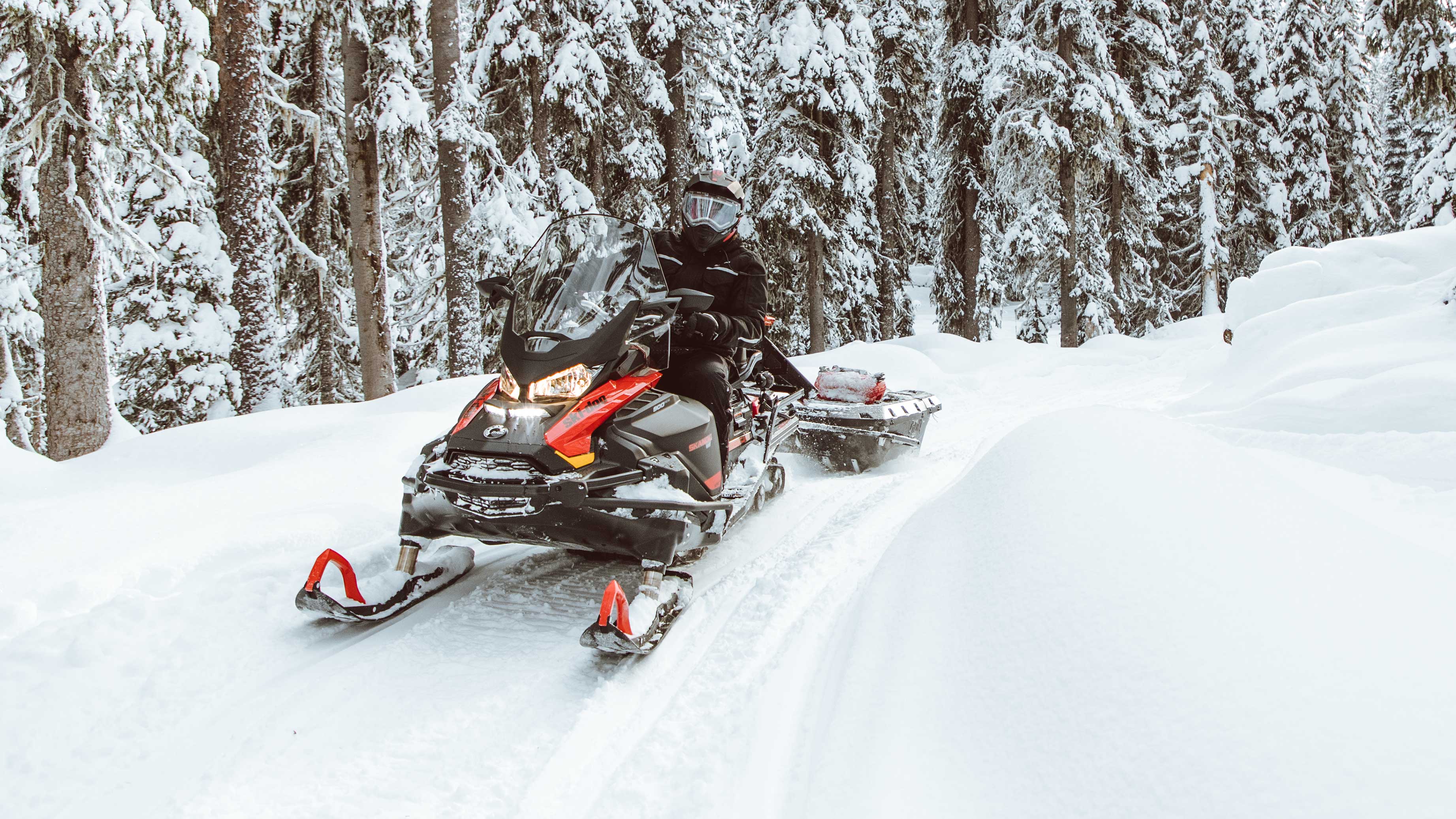 Man working with his Ski-Doo Skandic