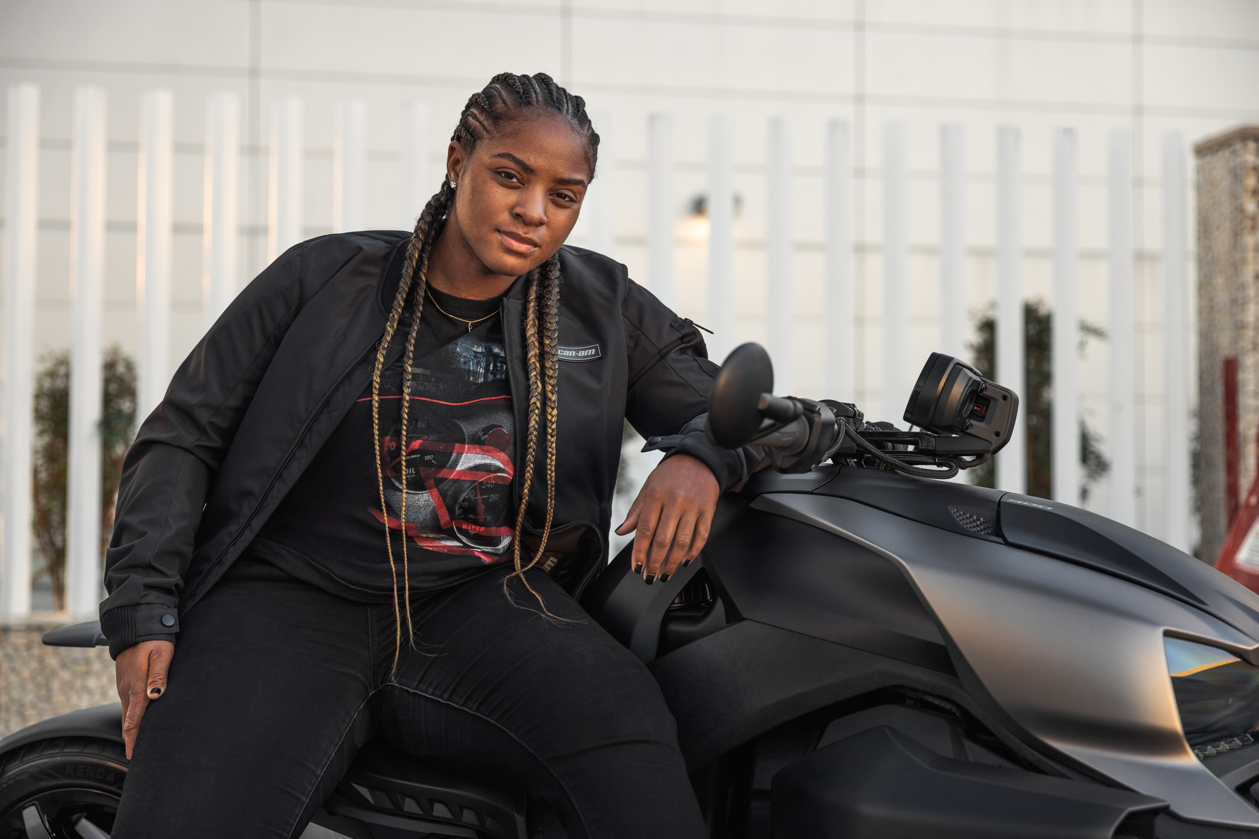 Brehanna Daniels sitting on a vehicle