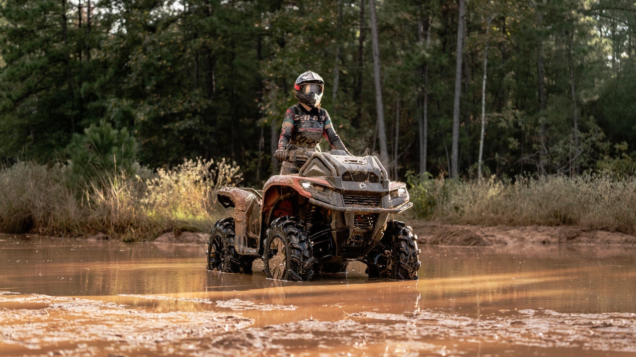 A Can-Am Outlander X mr 700 in the mud