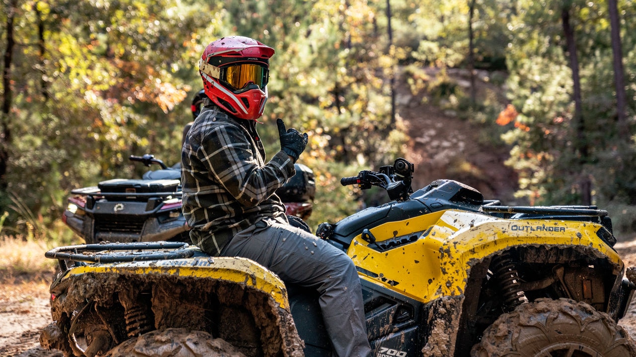 A Can-Am off-road Outlander XT 700 driver in the forest