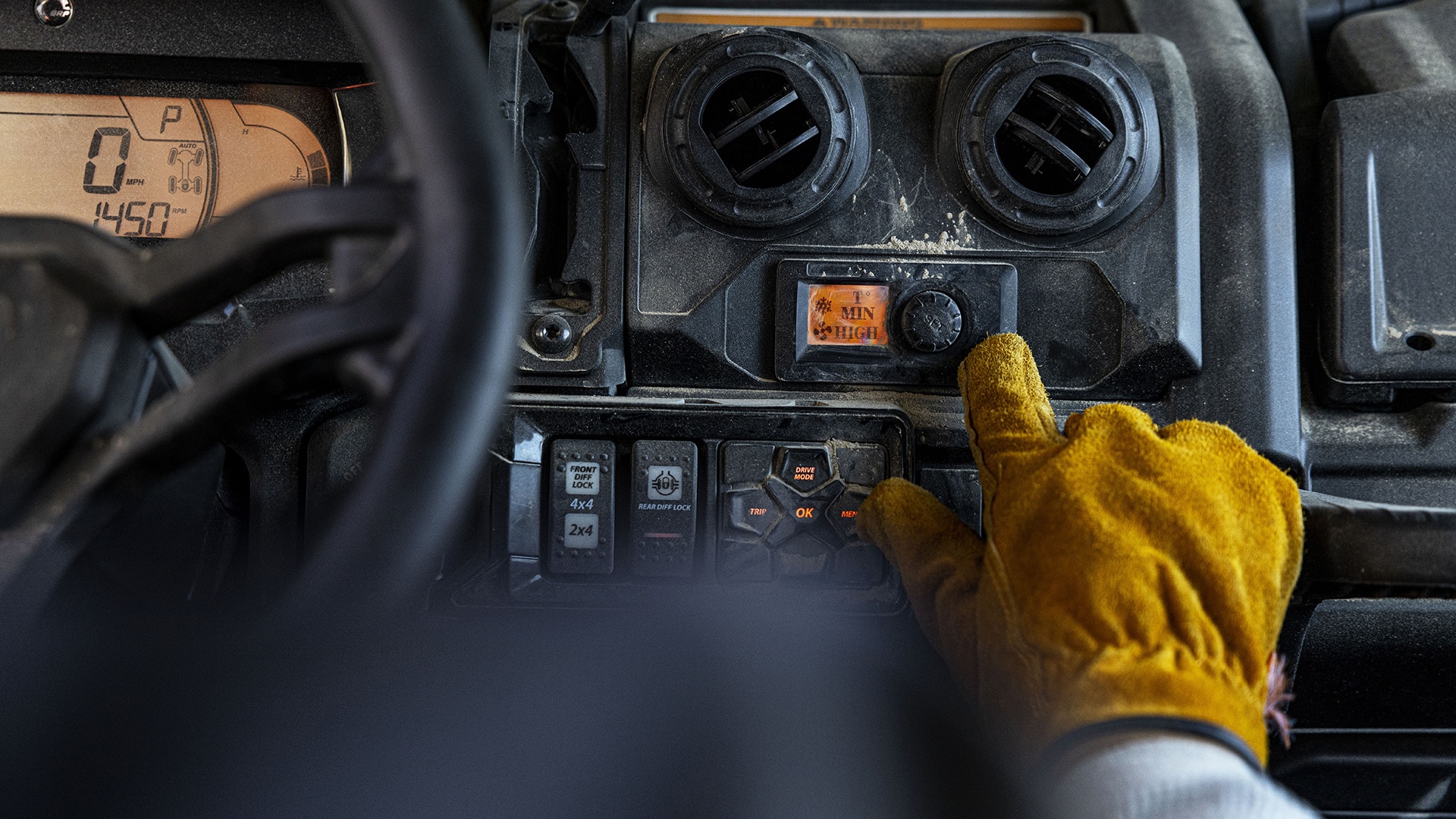Can-Am traxter cockpit photo featuring the HVAC system and its controls