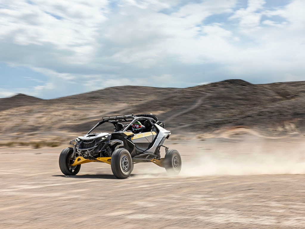 A Can-Am Maverick R speeding in the desert
