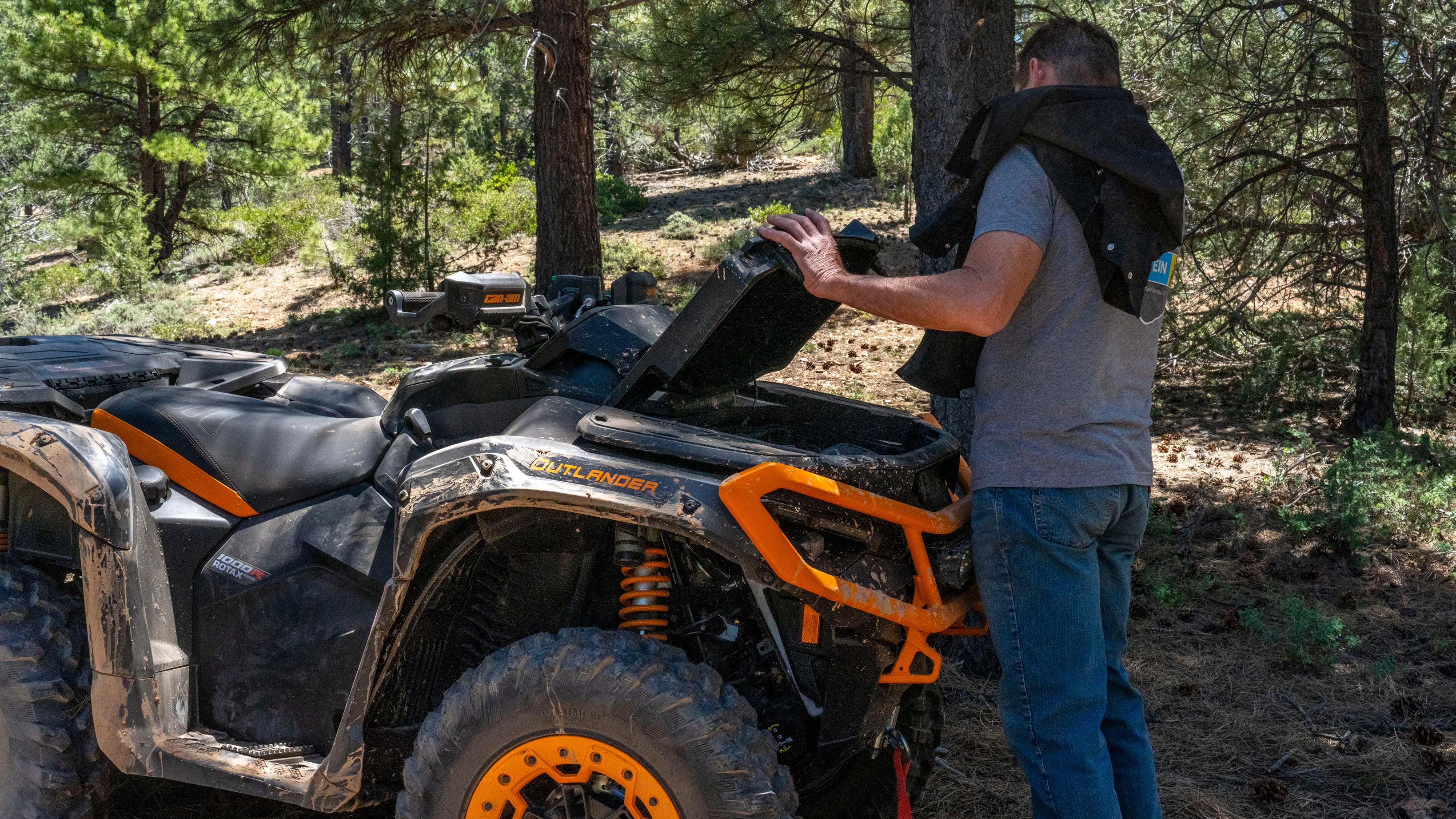 Man using the storage capacity of his Can-Am Outlander