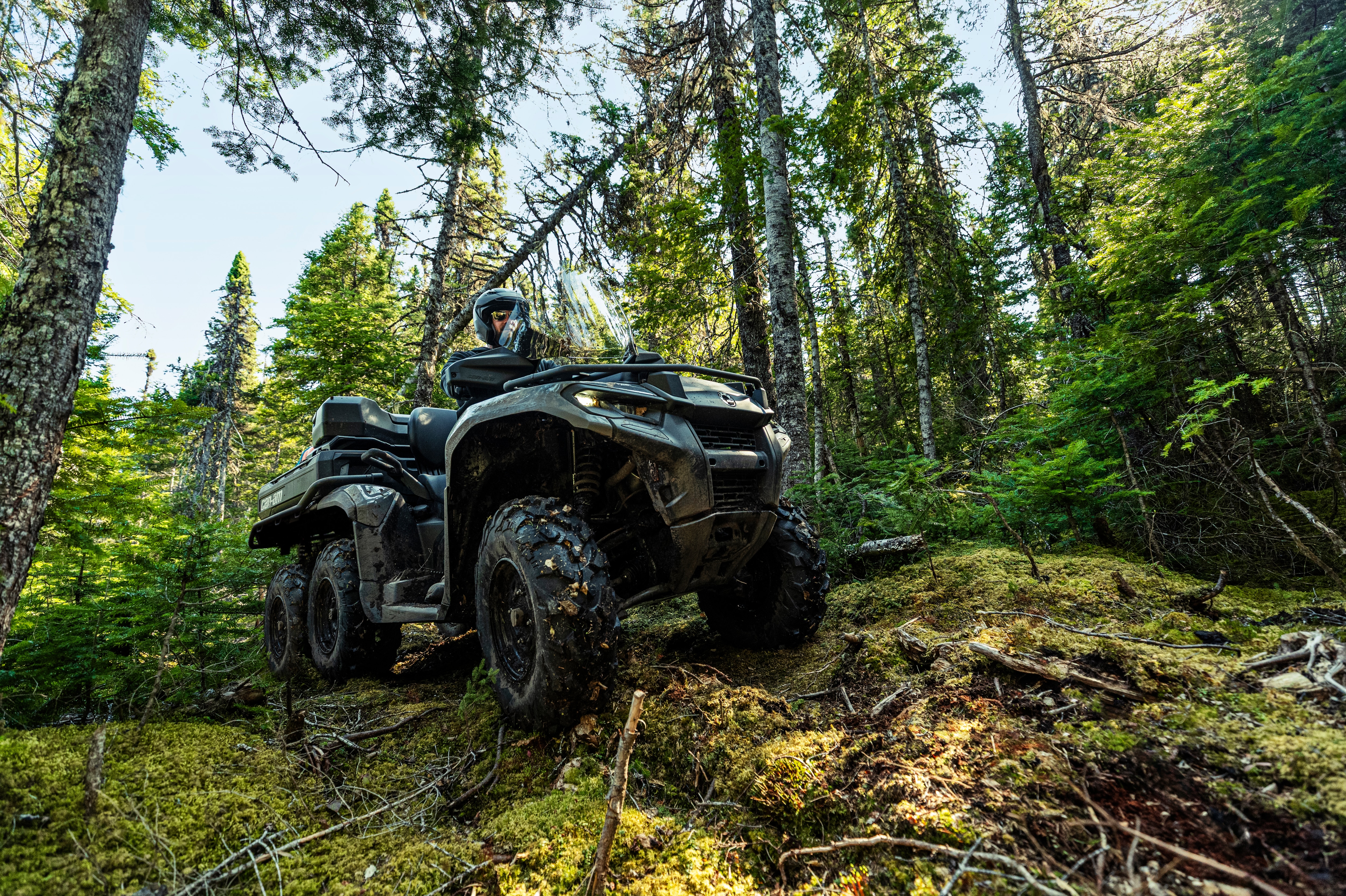 2026 Can-Am Outlander 6x6 ATV passing over rocks and obstacles