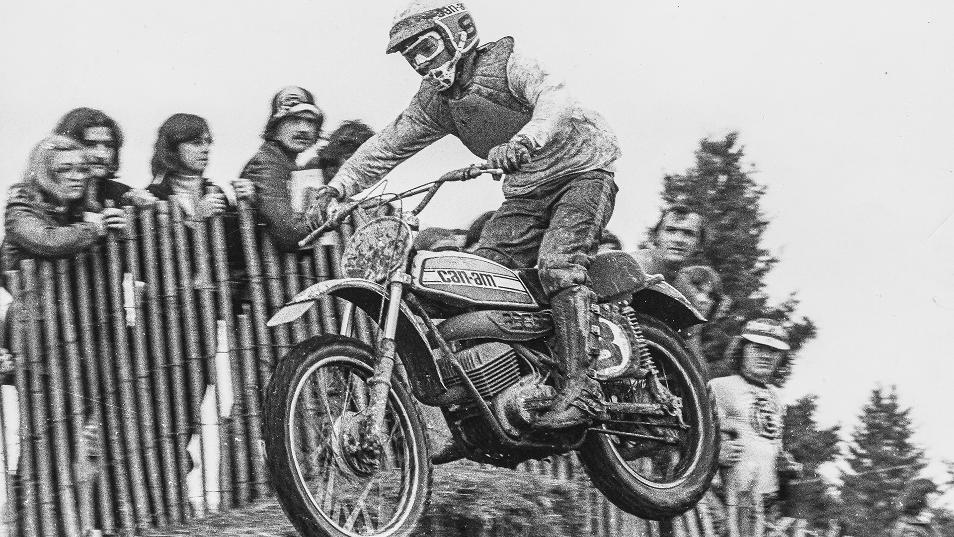Motocross rider jumping with a classic Can-Am motorcycle