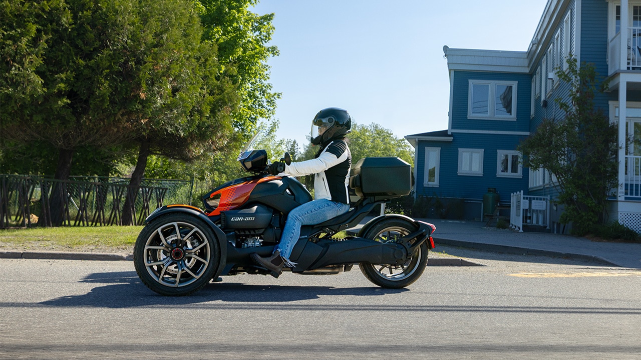 2026 Can-Am 3-wheel vehicle parked near a blue house