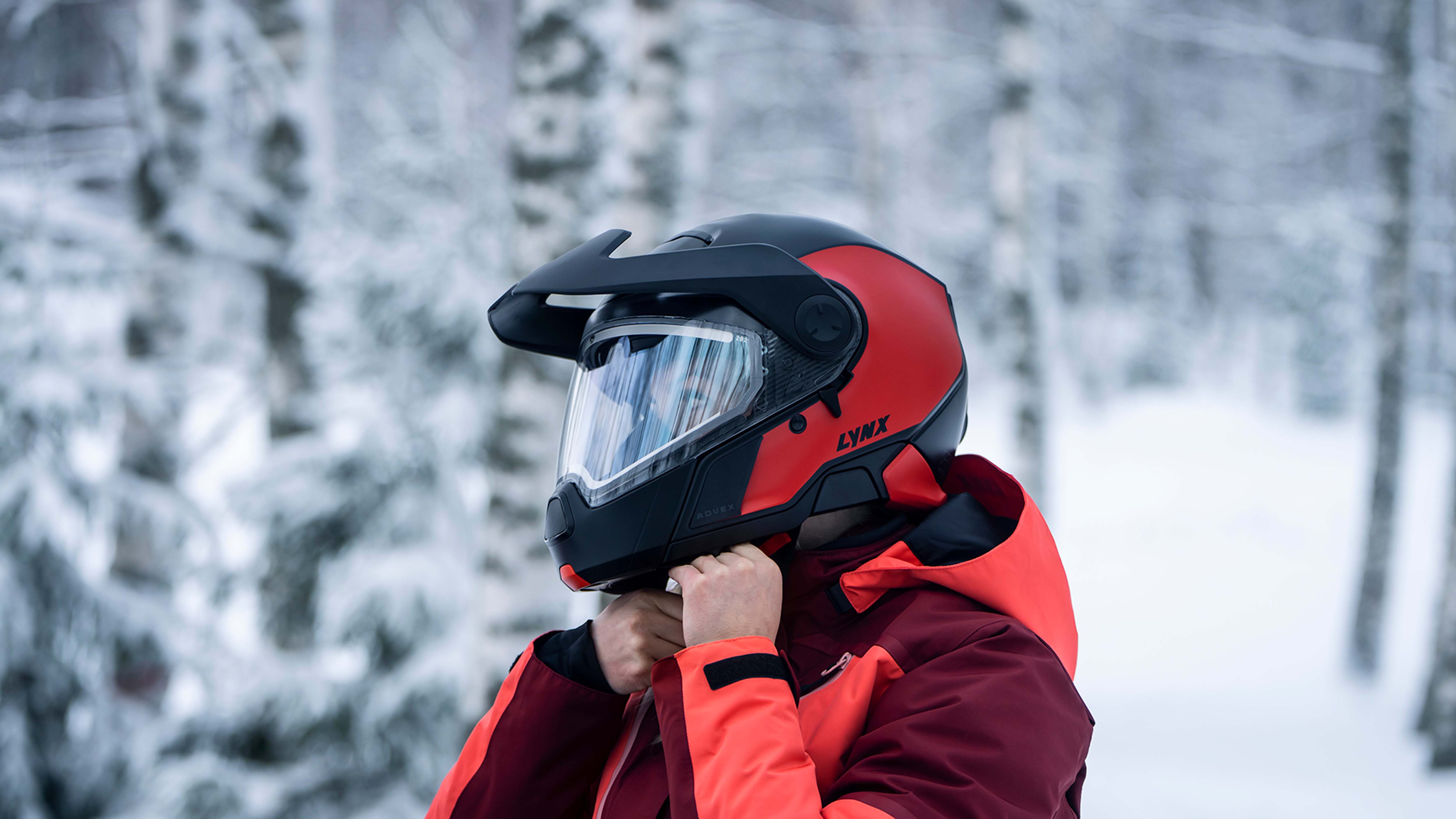 Someone riding a Lynx snowmobile