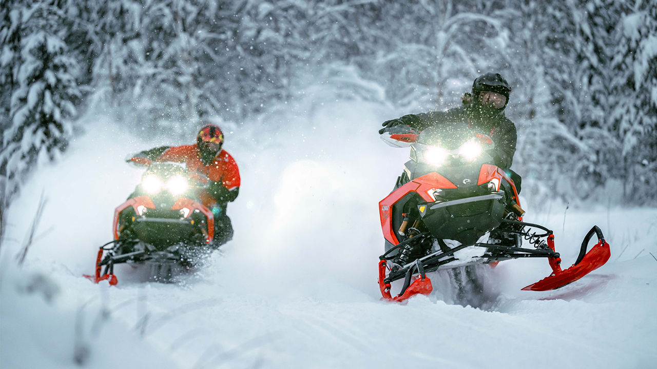 Lynx 49 Ranger PRO snowmobile riding in the forest