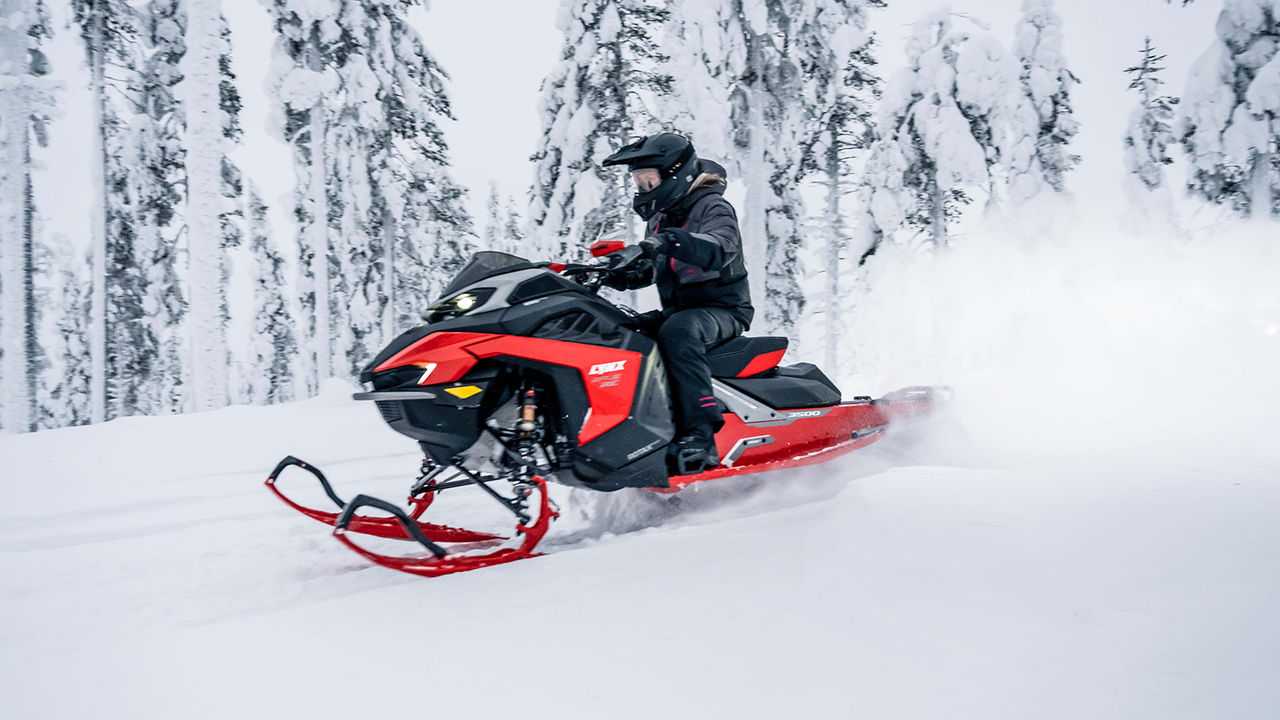 Rave RE snowmobile riding on snowy trail