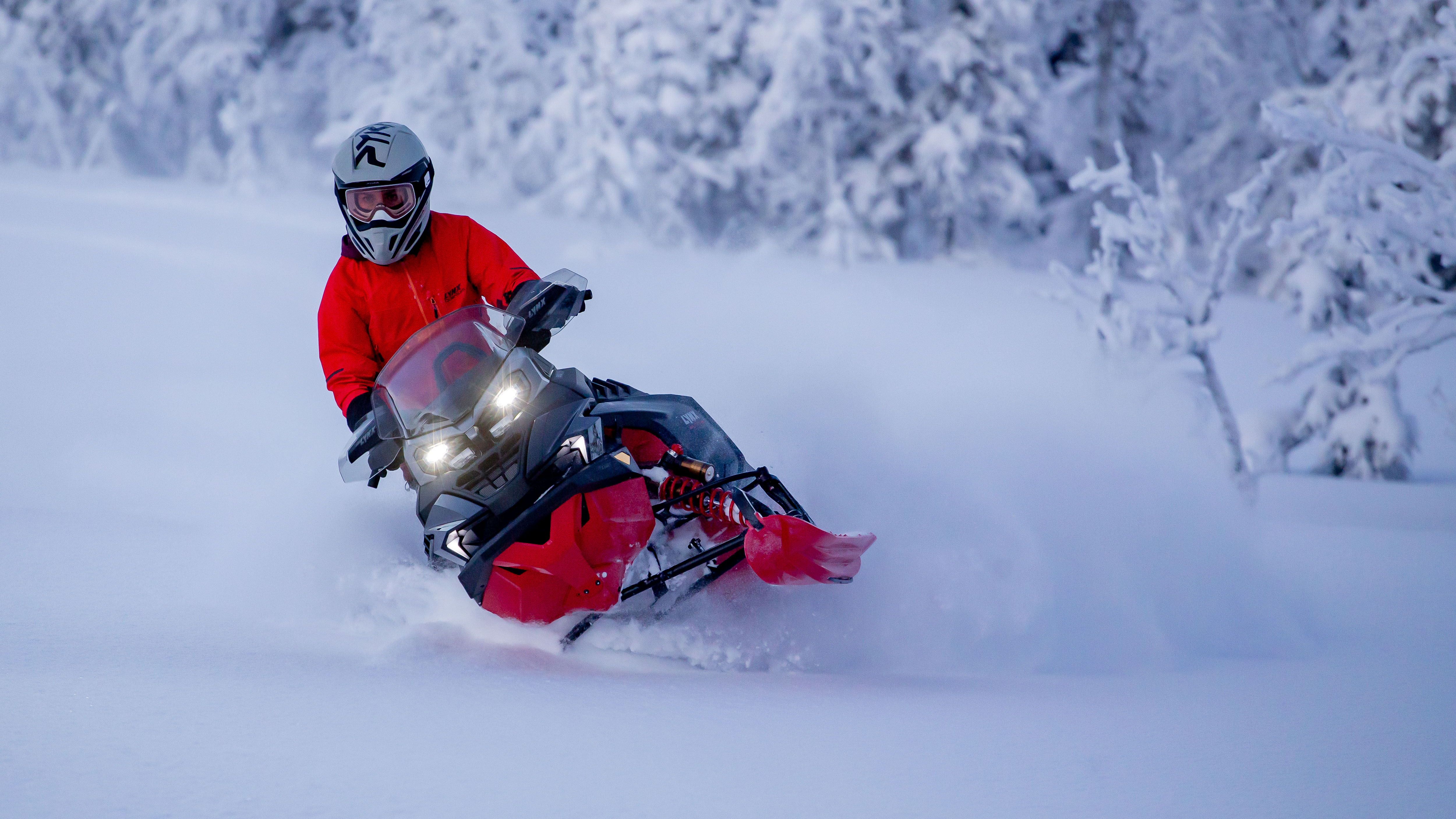 2026 Lynx Brutal RE snowmobile making tight turn in deep snow