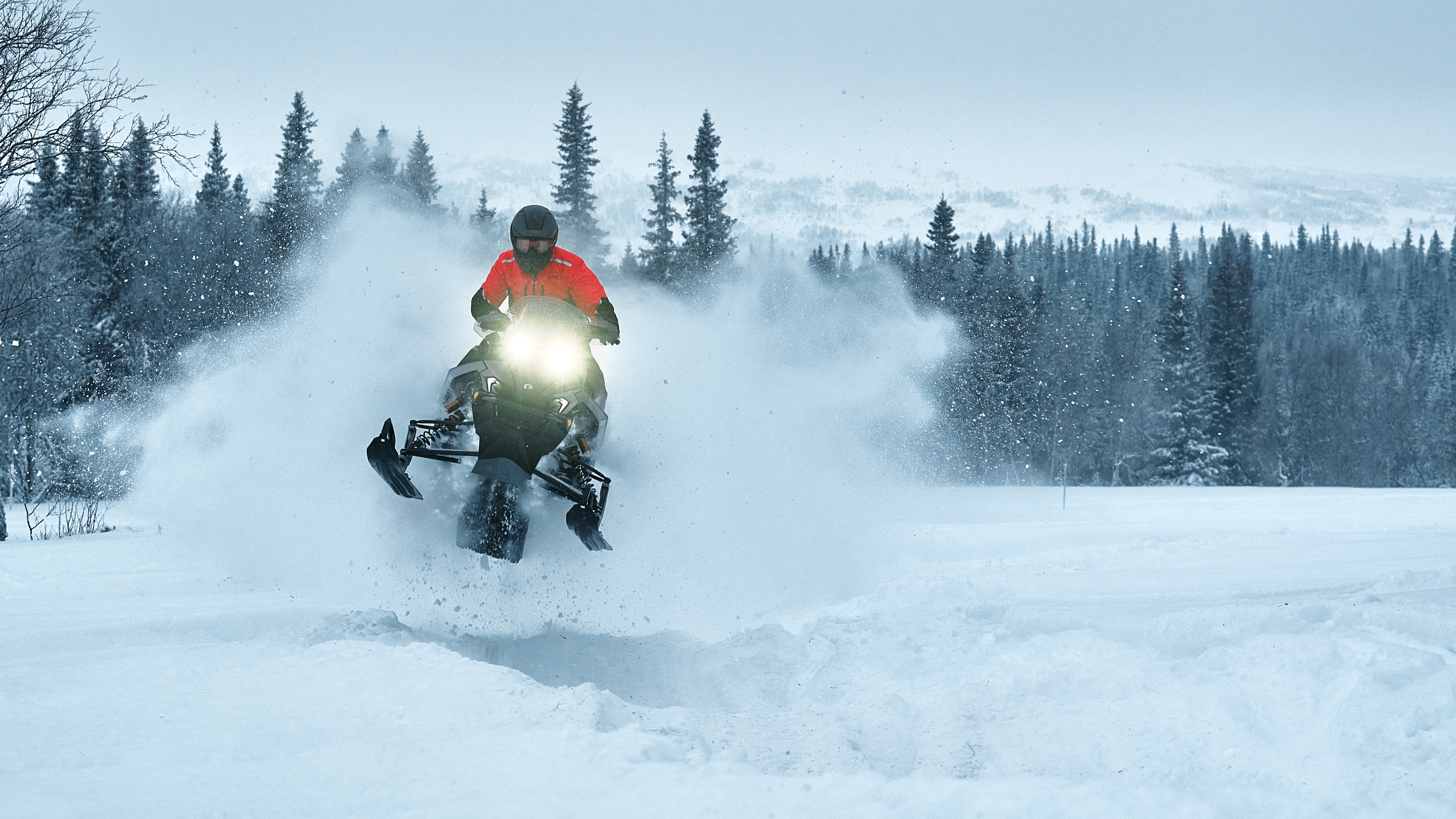 Lynx Rave RE 850 Turbo R 2026 snowmobile riding aggressively on bumpy trail