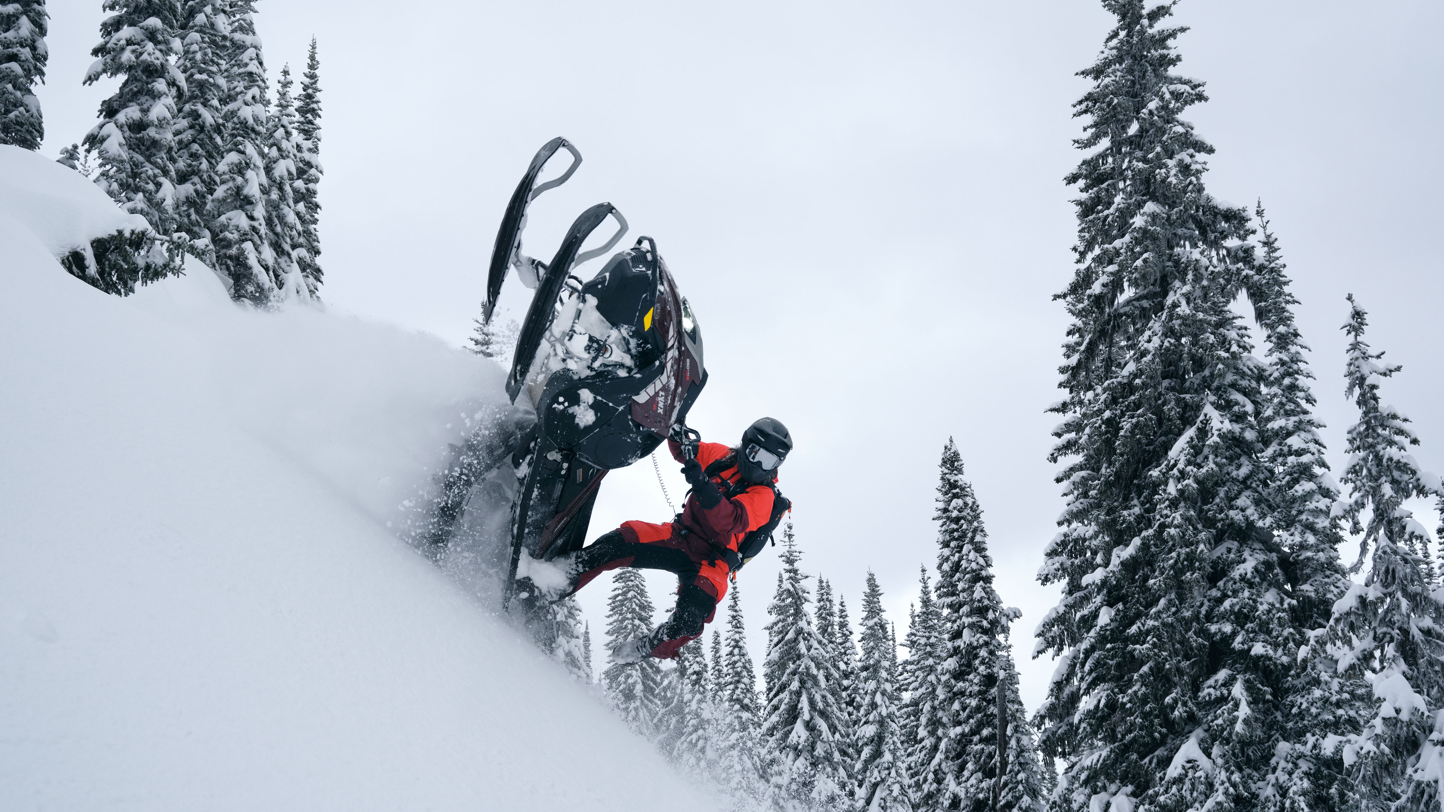 Lynx Shredder RE snowmobile making a tight turn in deep snow