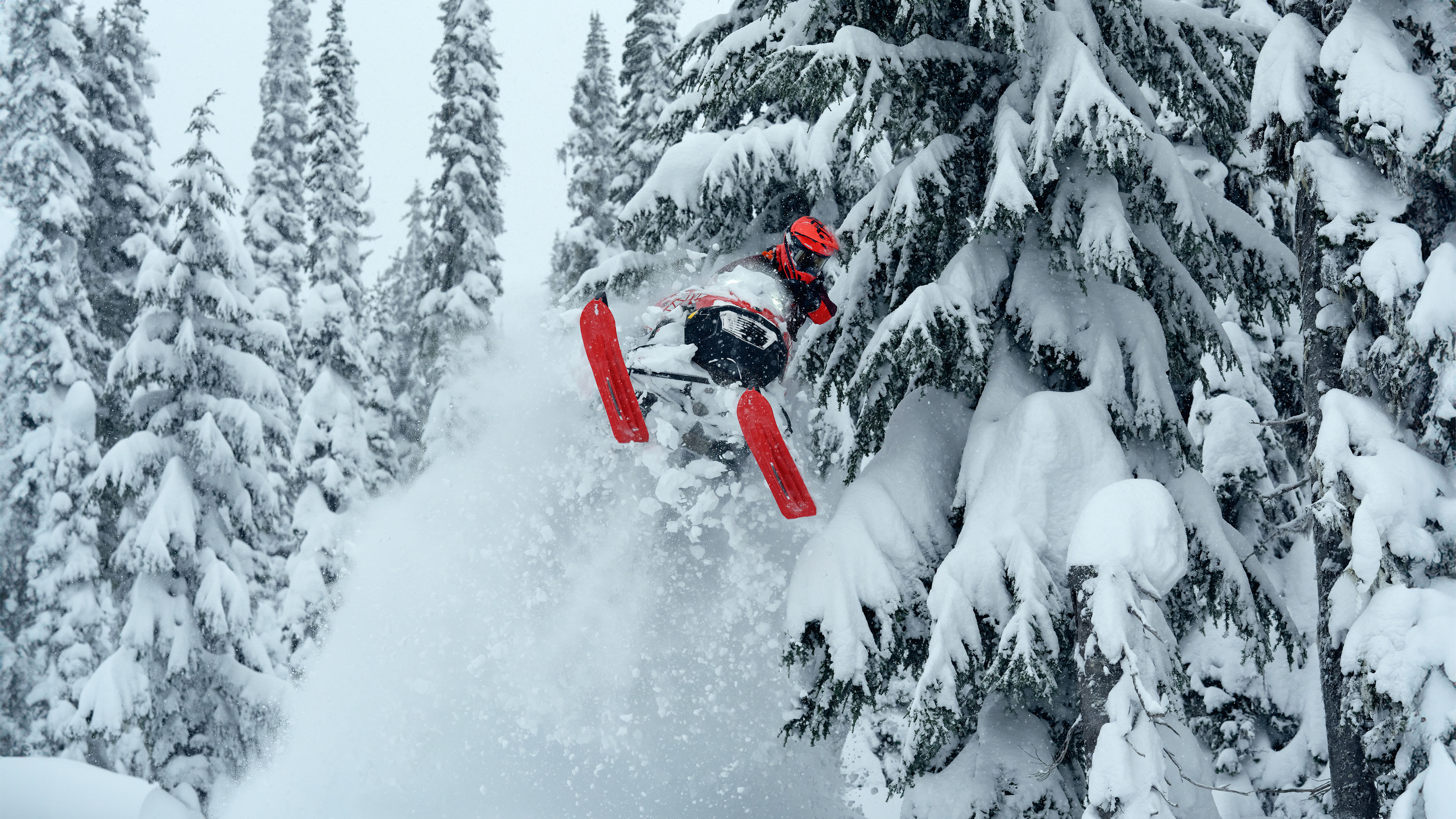 Lynx Shredder RE snowmobile lifting skis at mountains