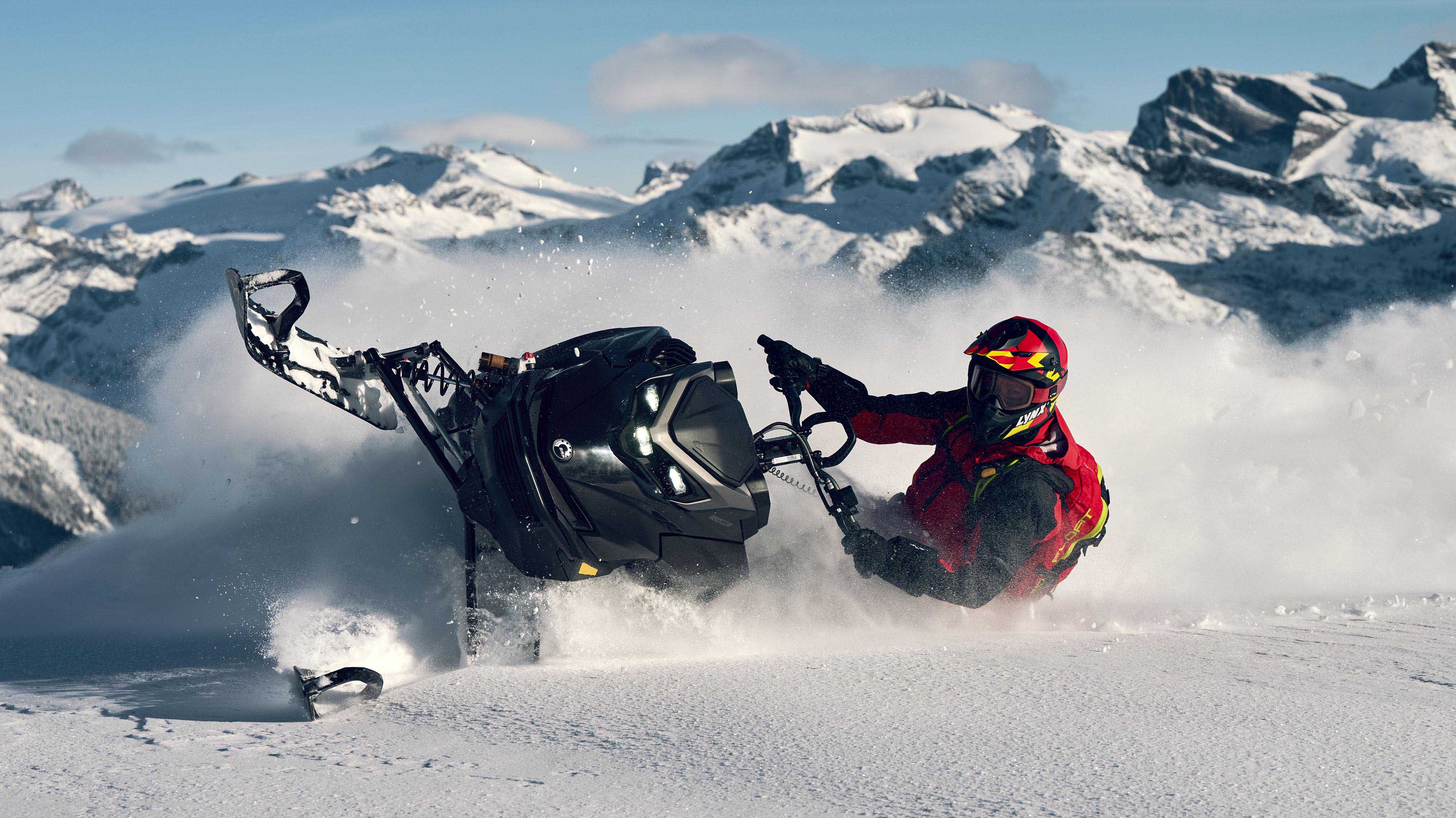 Lynx Shredder RE snowmobile making a tight turn in deep snow