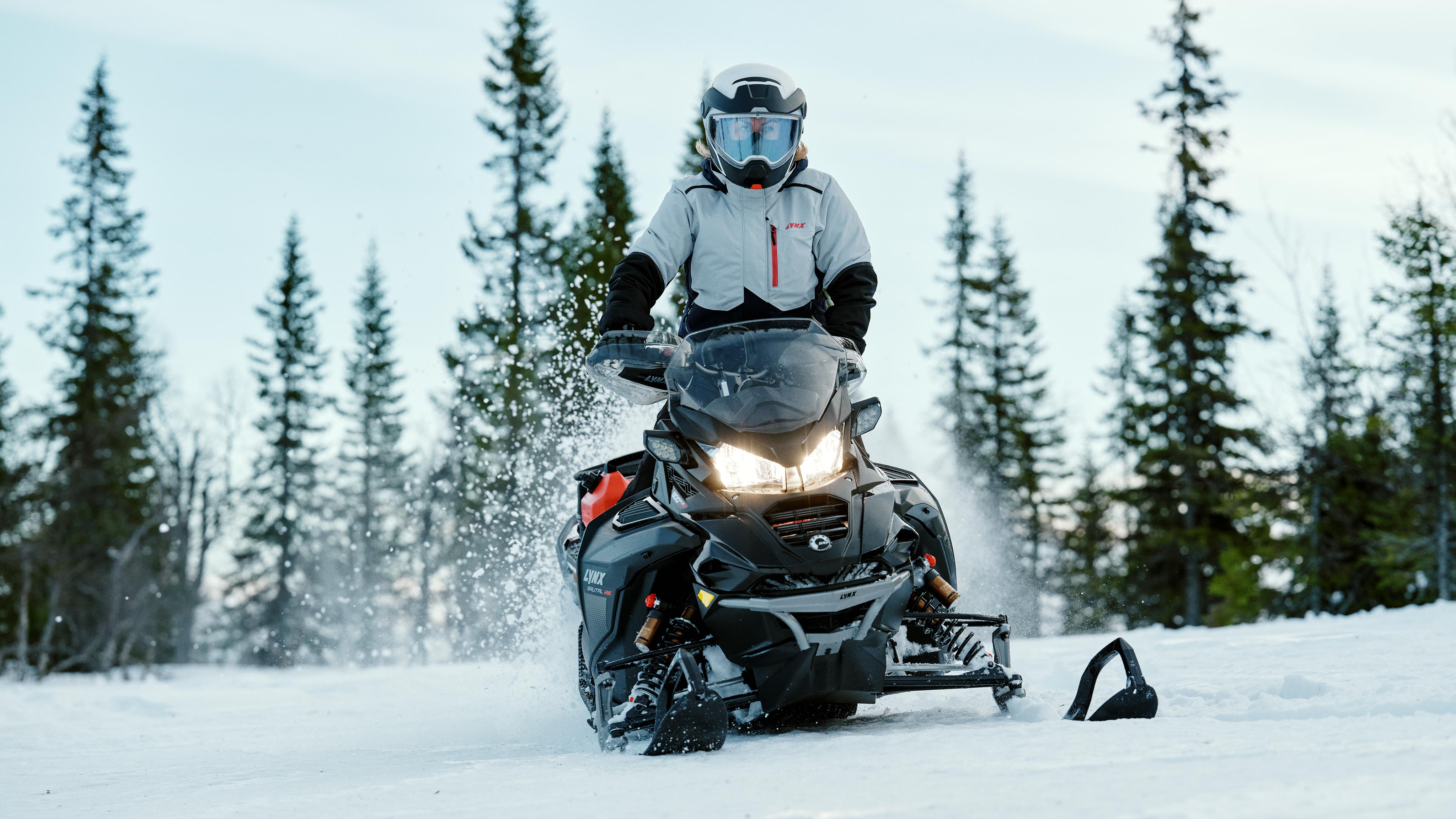 Woman on the 2025 Lynx Brutal snowmobile