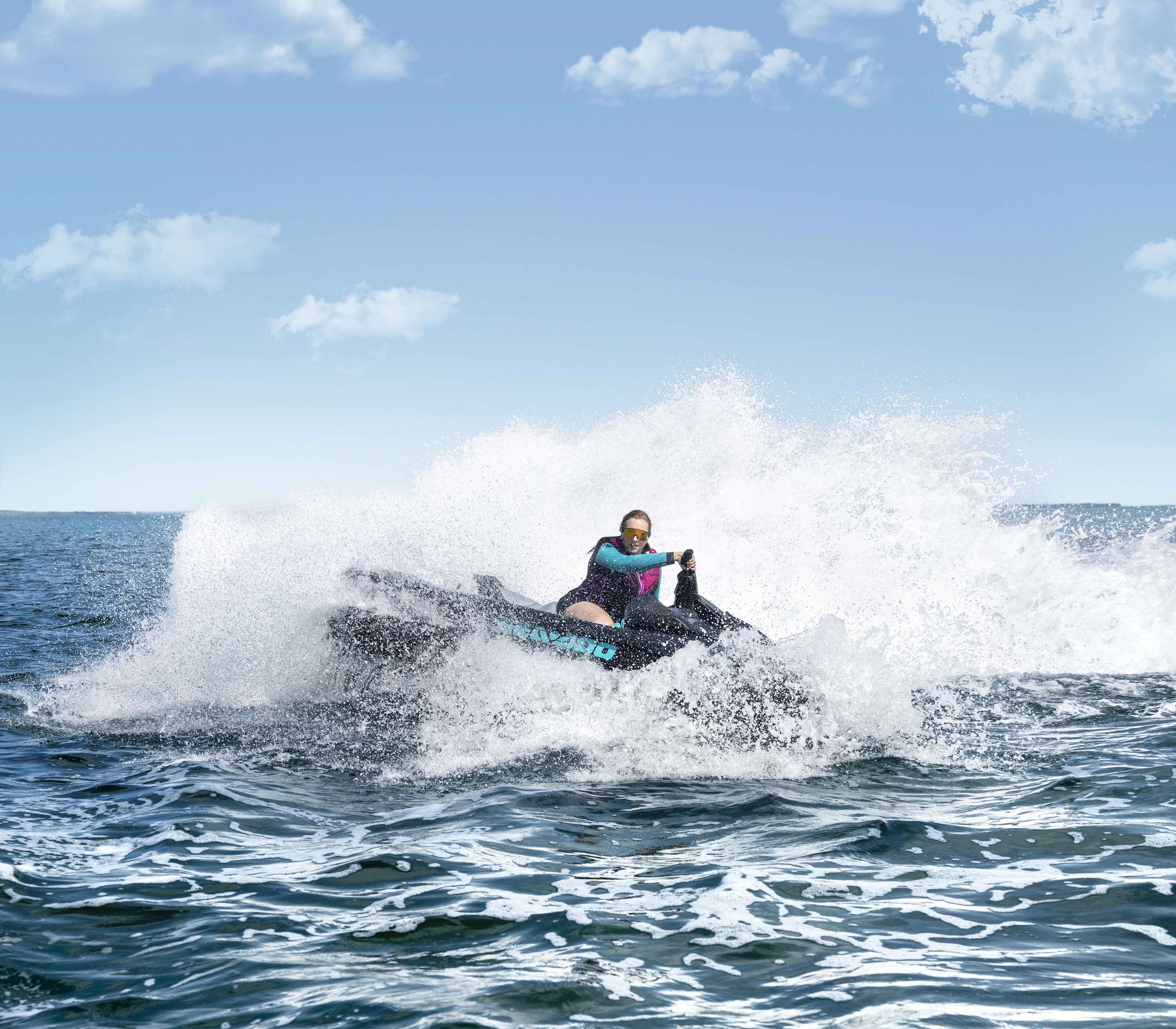 Woman riding a 2024 Sea-Doo GTR personal watercraft