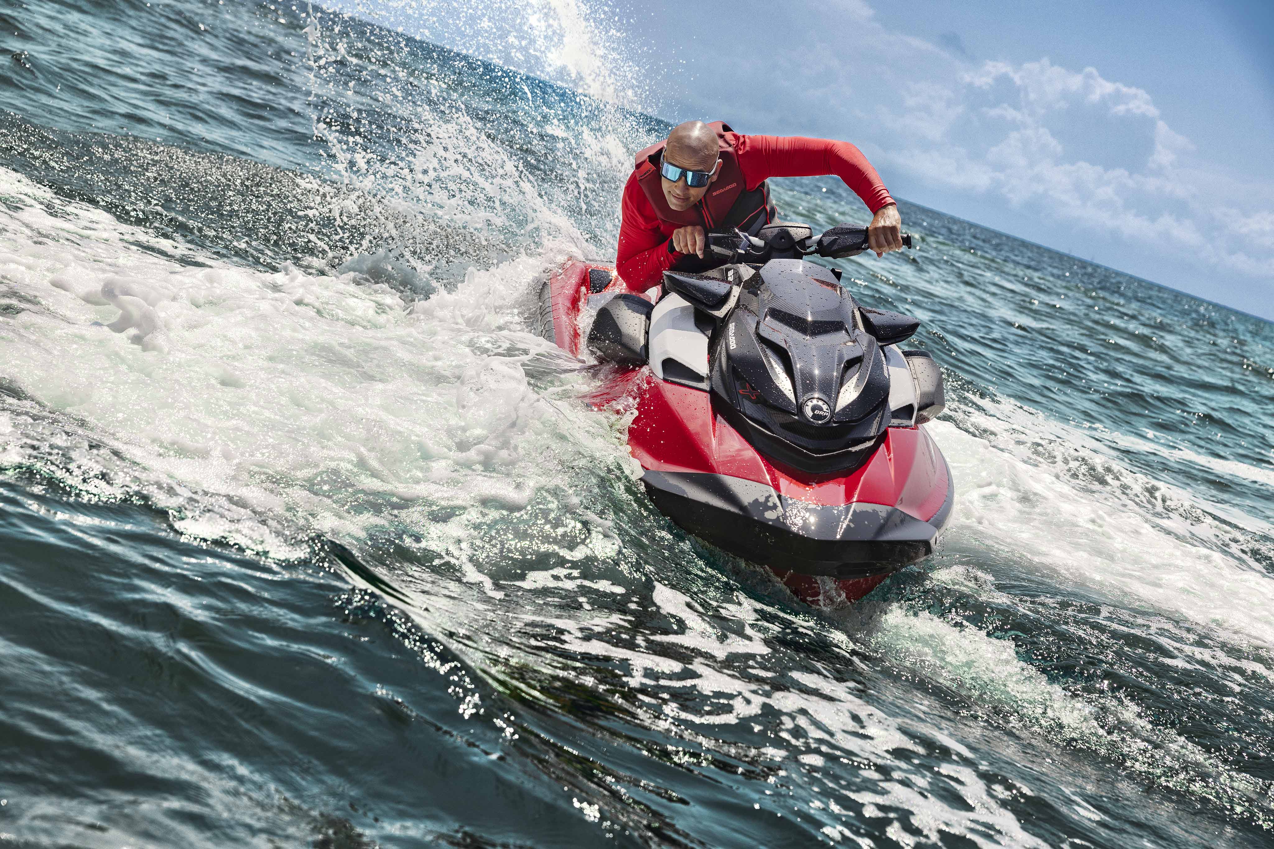 Man doing a quick turn on a high performance Sea-Doo RXP-X personal watercraft