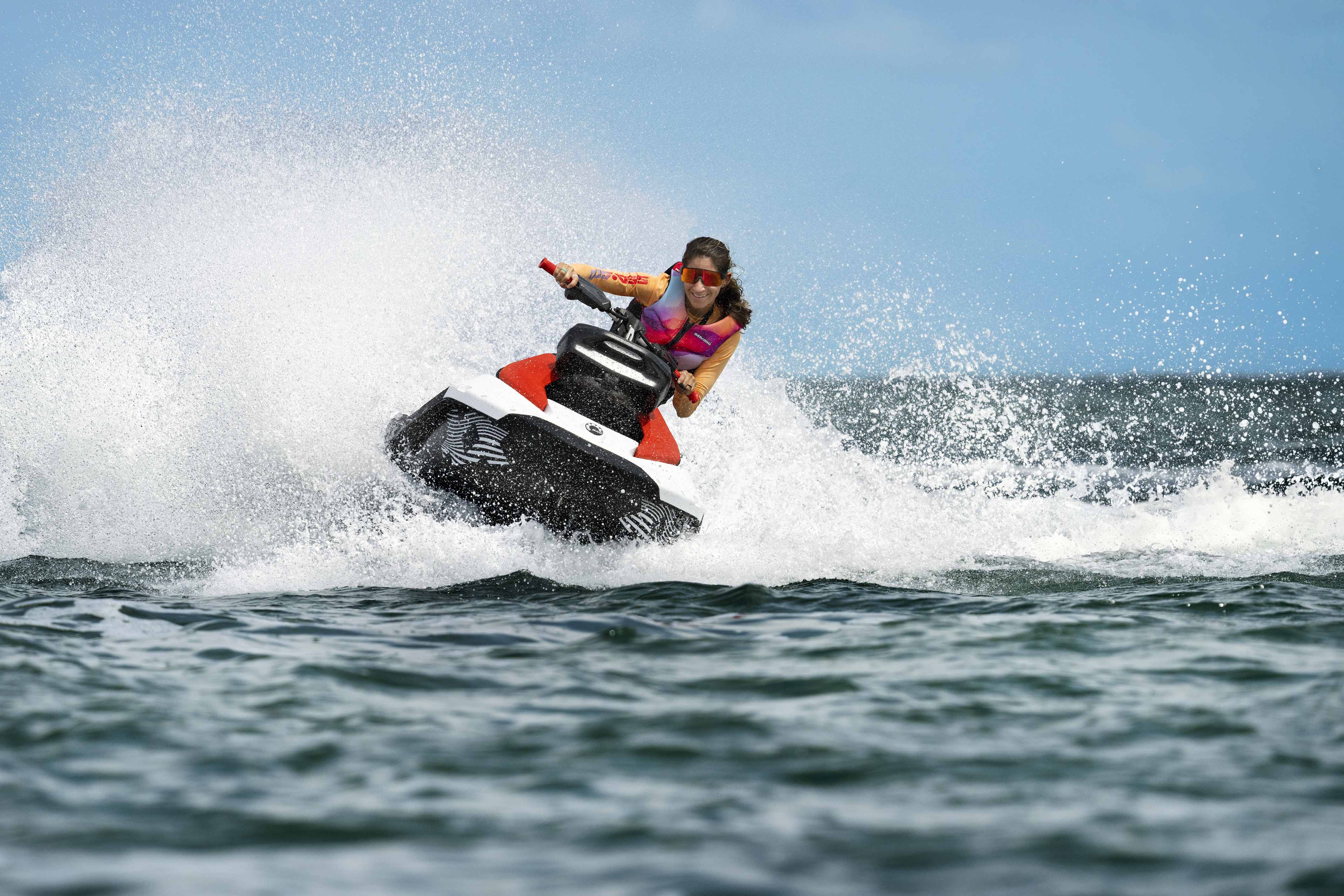 Woman riding a Sea-Doo Spark Trixx personal watercraft