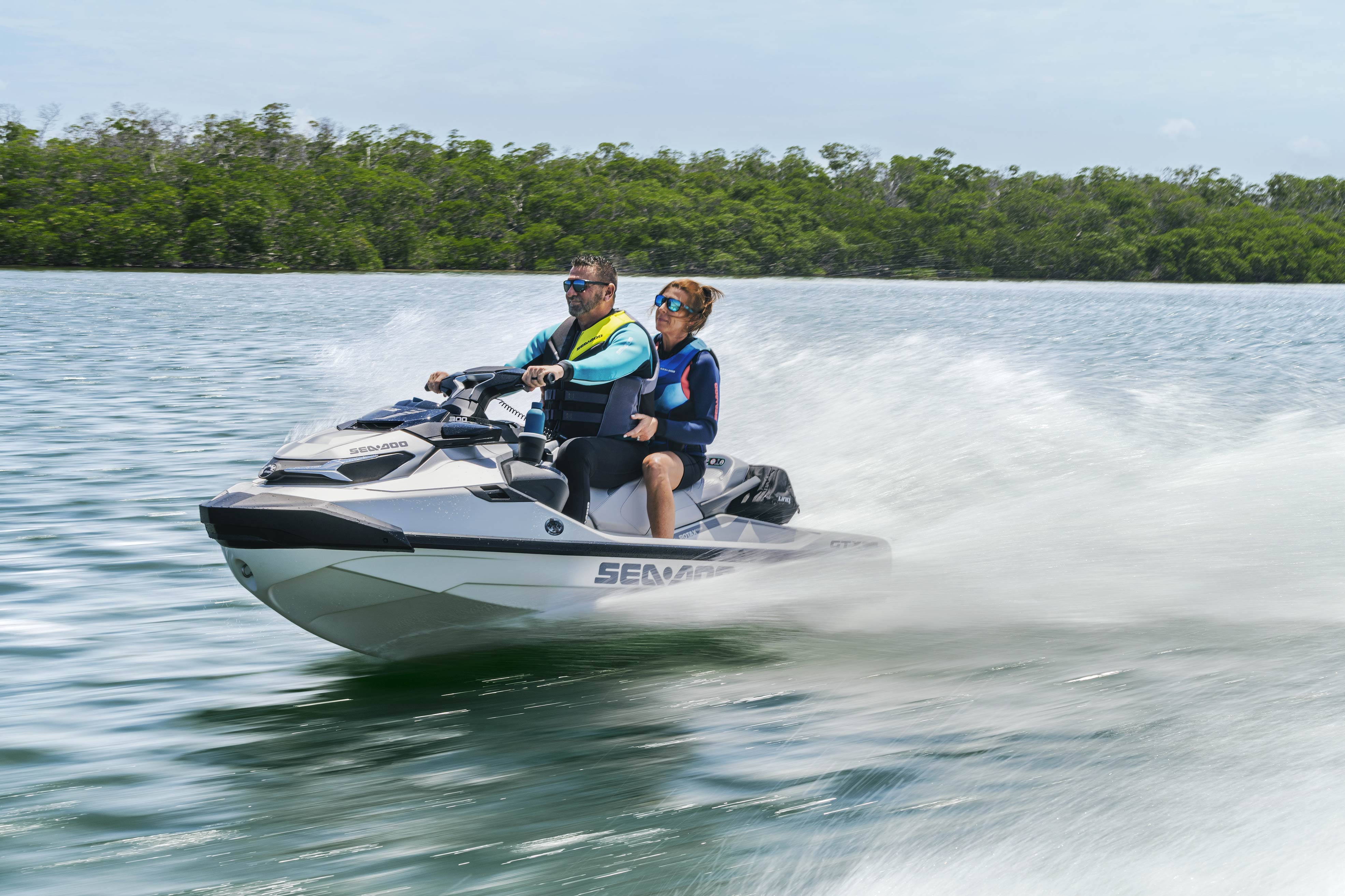 Couple riding a 2024 Sea-Doo GTX Limited