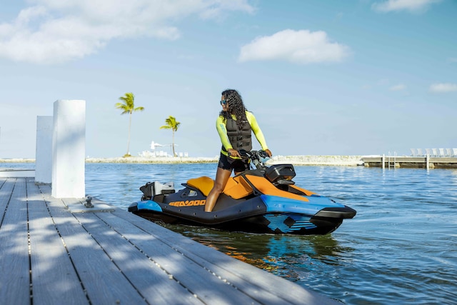 Couple riding a Sea-Doo Spark Trixx personal watercraft