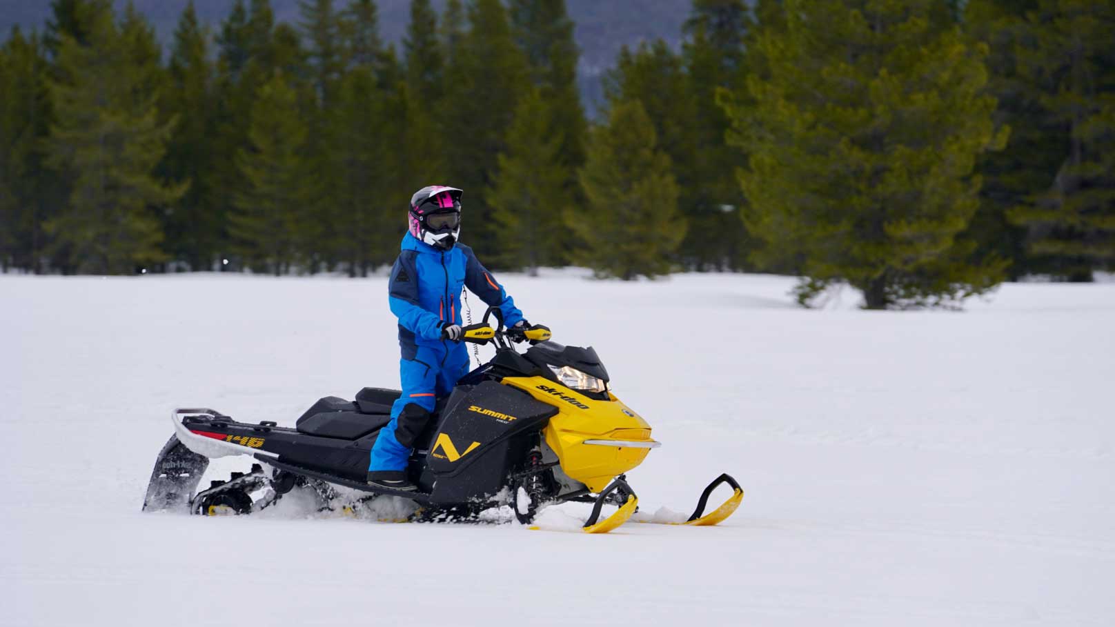 Young girl riding the Summit Neo