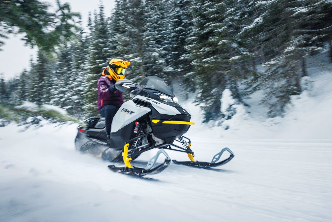 Woman on the MXZ Adrenaline with Blizzard Package