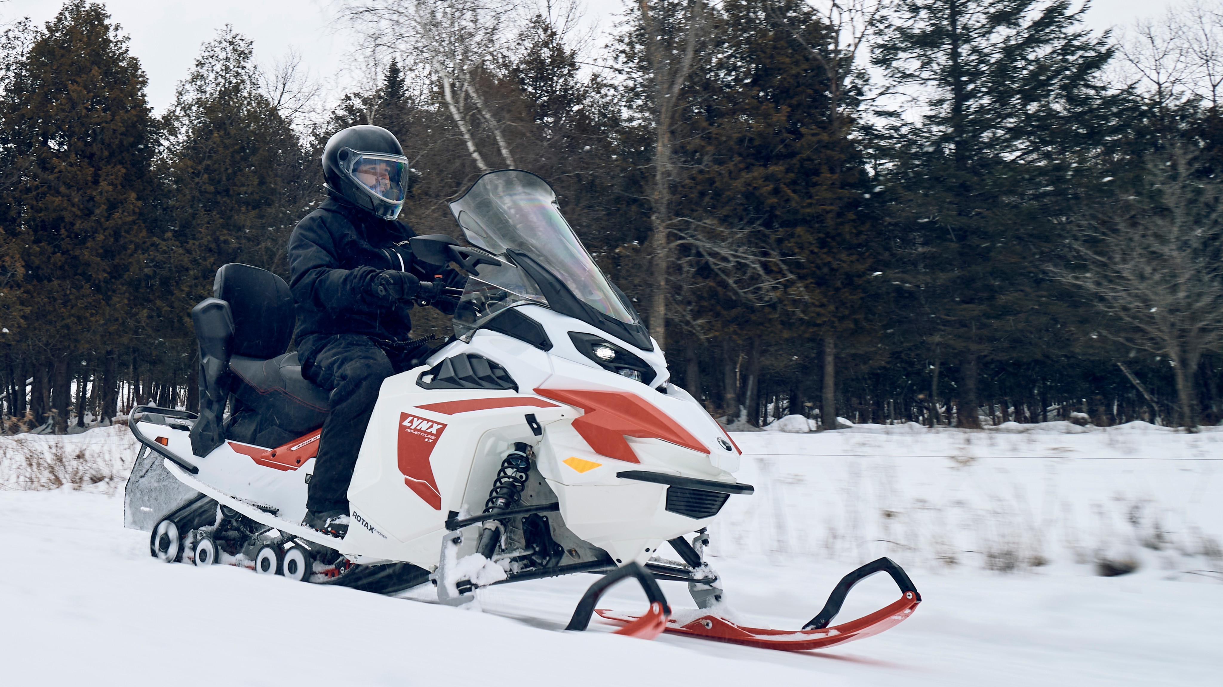 Man in a trail on the new lynx adventure electric