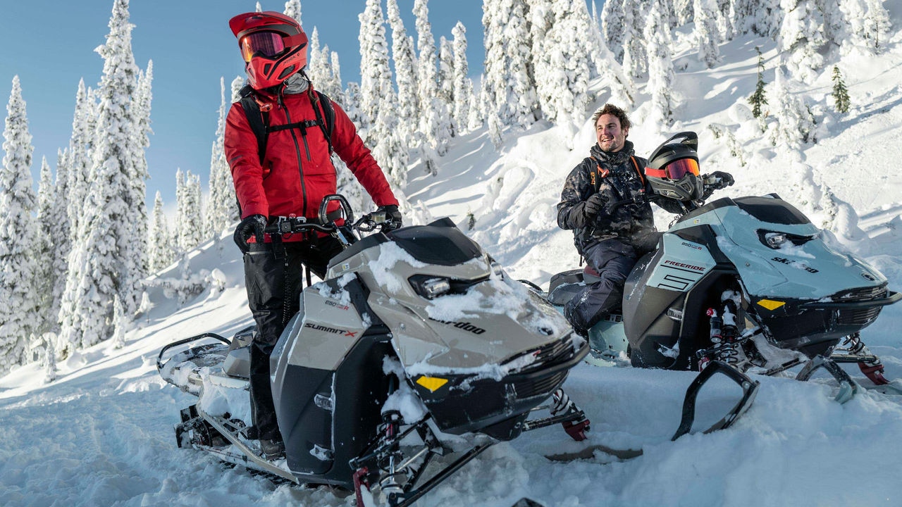 Two Ski-Doo riders in the mountain